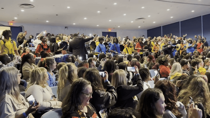 A crowd of kids screaming 