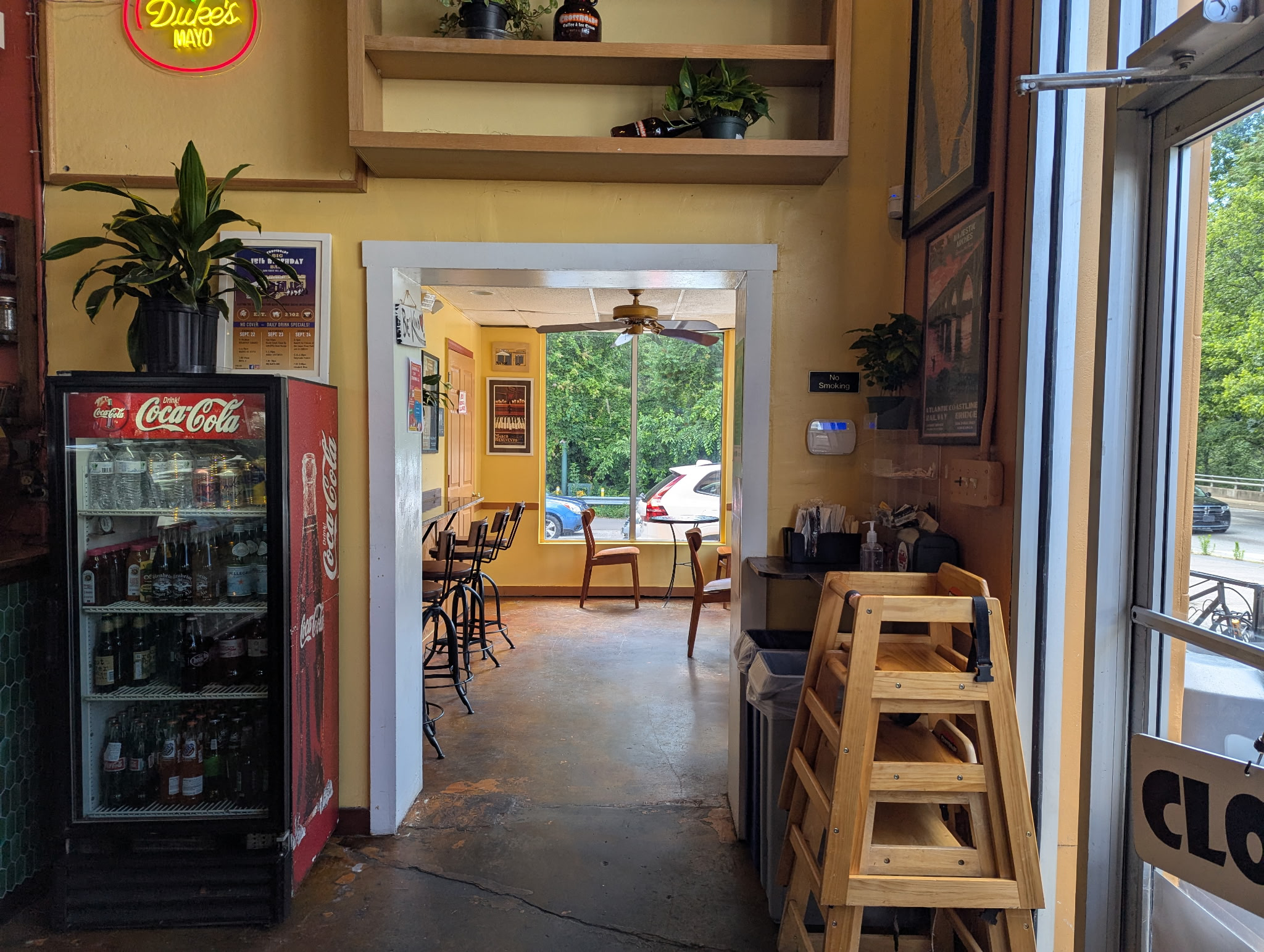 The other side of crossroads showing like 5 chairs and 2 tables 