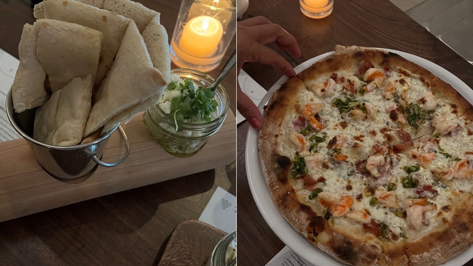Two-panel dining scene: left shows a metal bucket of flatbreads with a candle and fresh herbs in a jar; right shows a shrimp-topped cheese pizza on a white plate, a hand reaching to cut a slice.