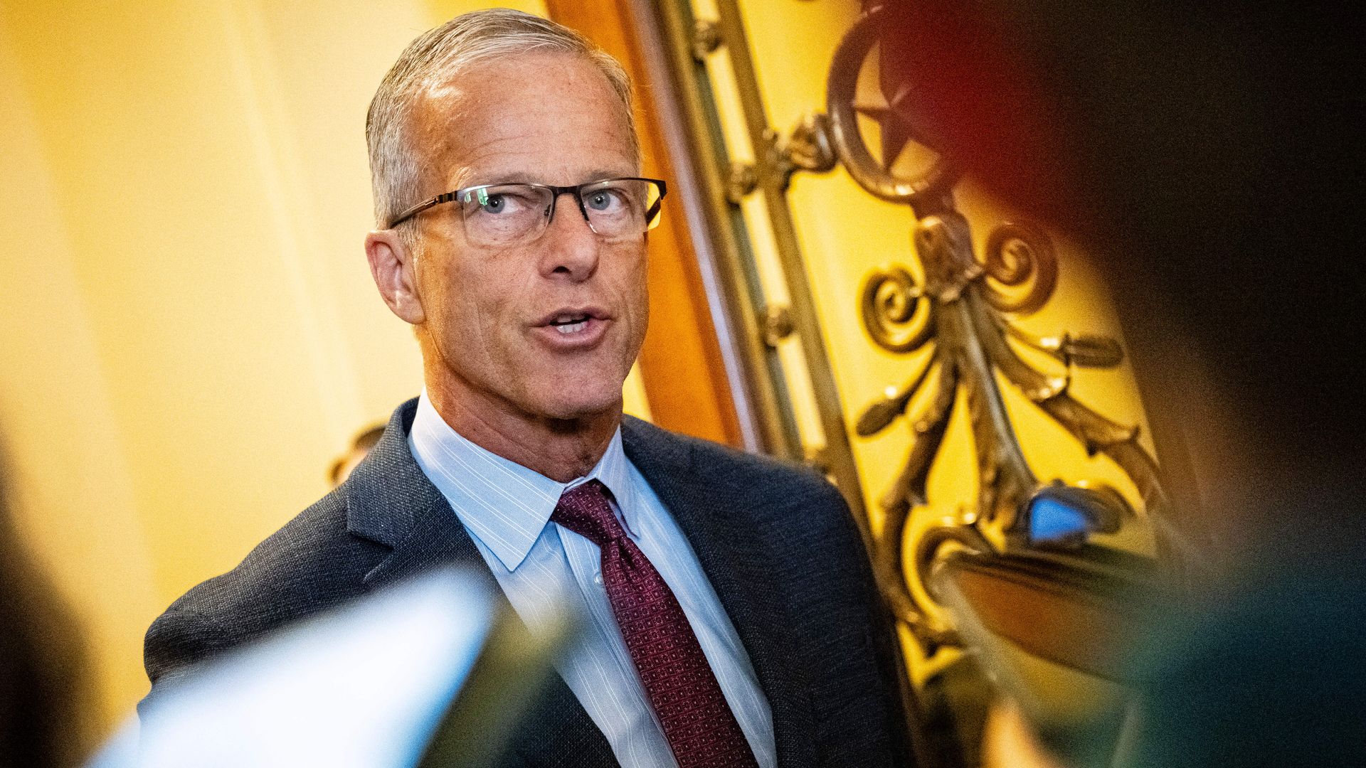 Senate Majority Leader John Thune speaks to members of the media outside the Senate chamber on July 20.