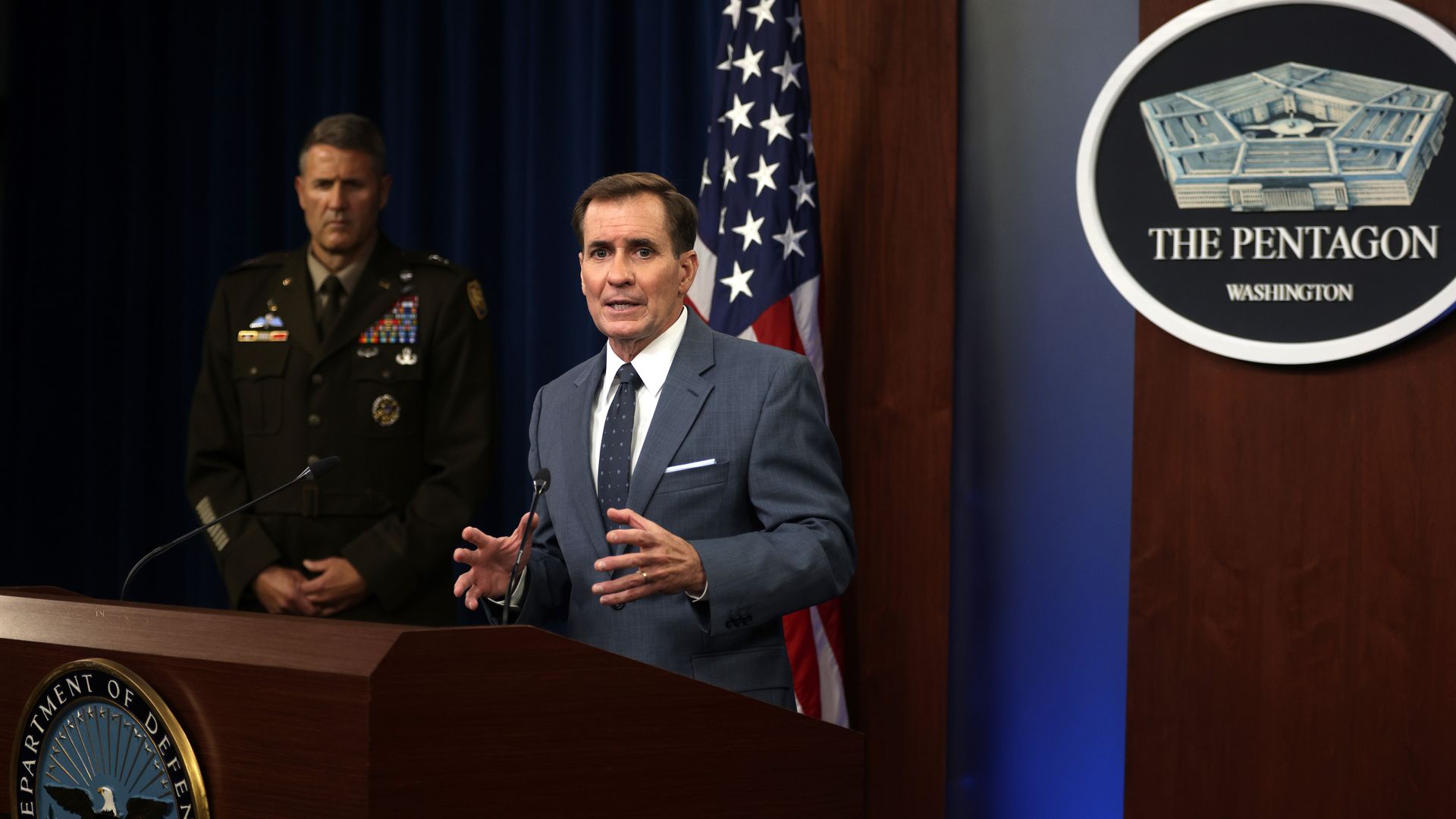 U.S. Department of Defense Press Secretary John Kirby (R) speaks as Army Major General William Taylor (L) listens during a news briefing at the Pentagon August 17, 2021