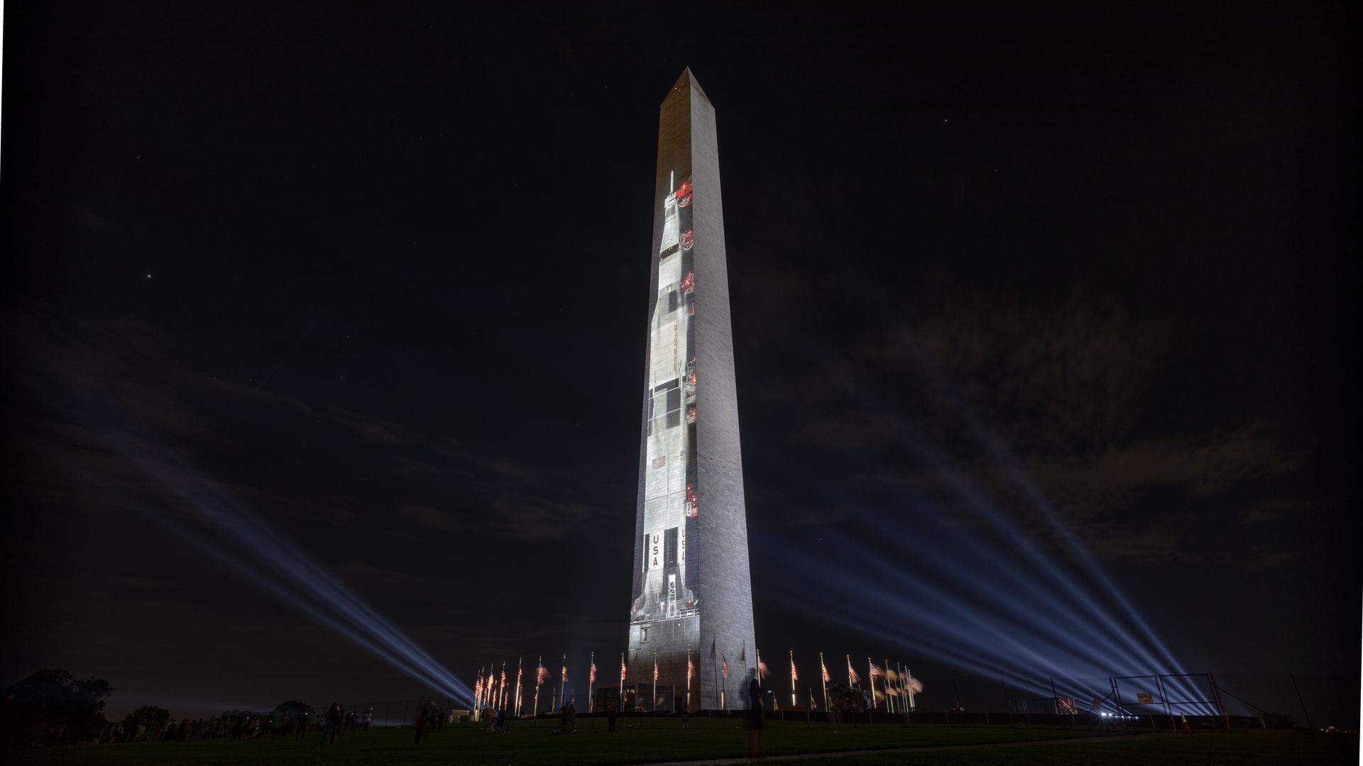 The Washington Monument, with the Saturn V rocket projected onto it