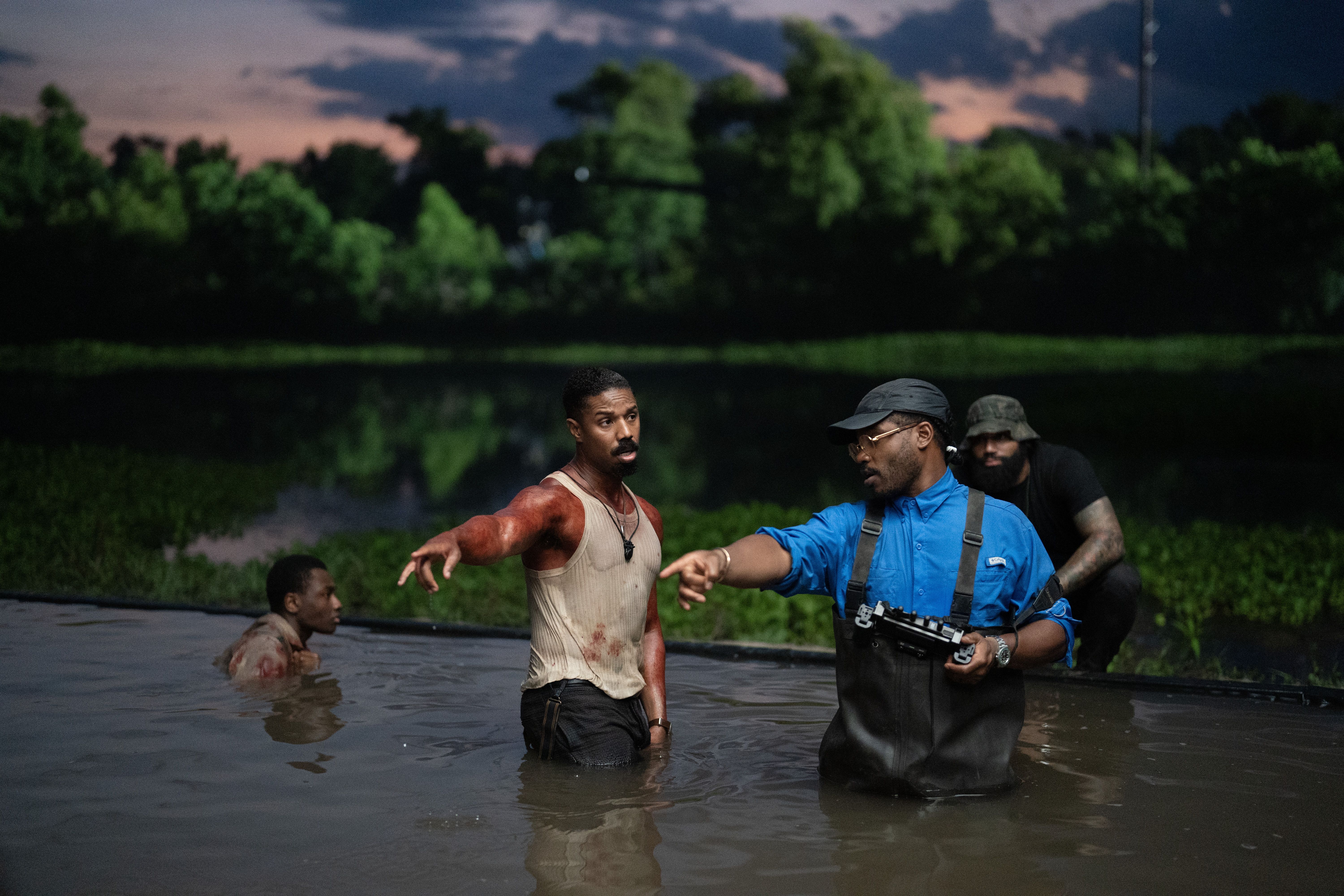 Photo shows people in the water filming.