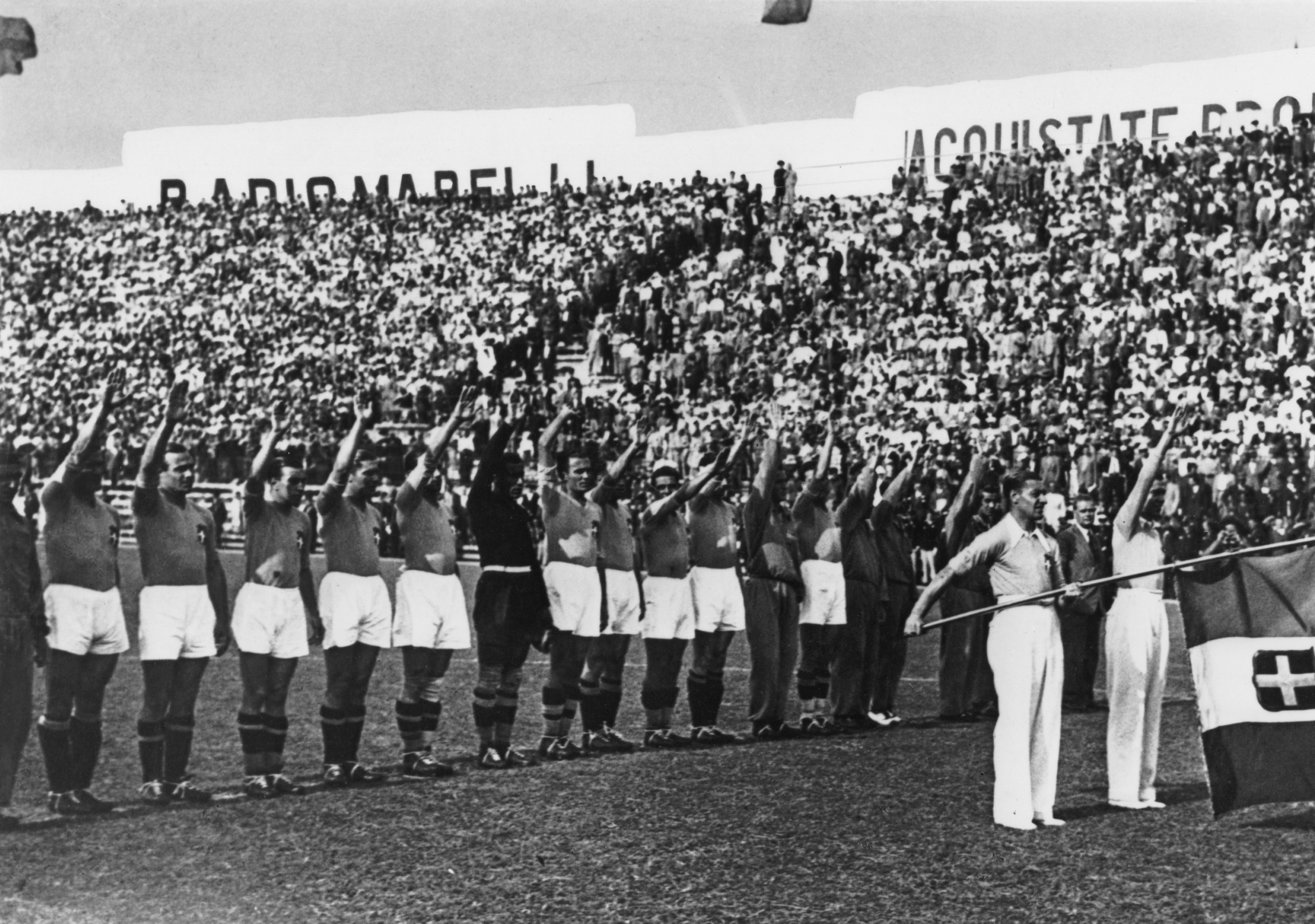 The Italian team performing a fascist salute before the 1934 World Cup Final in Rome, June 10, 1934. Photo credit: Keystone/Hulton Archive/Getty Images.