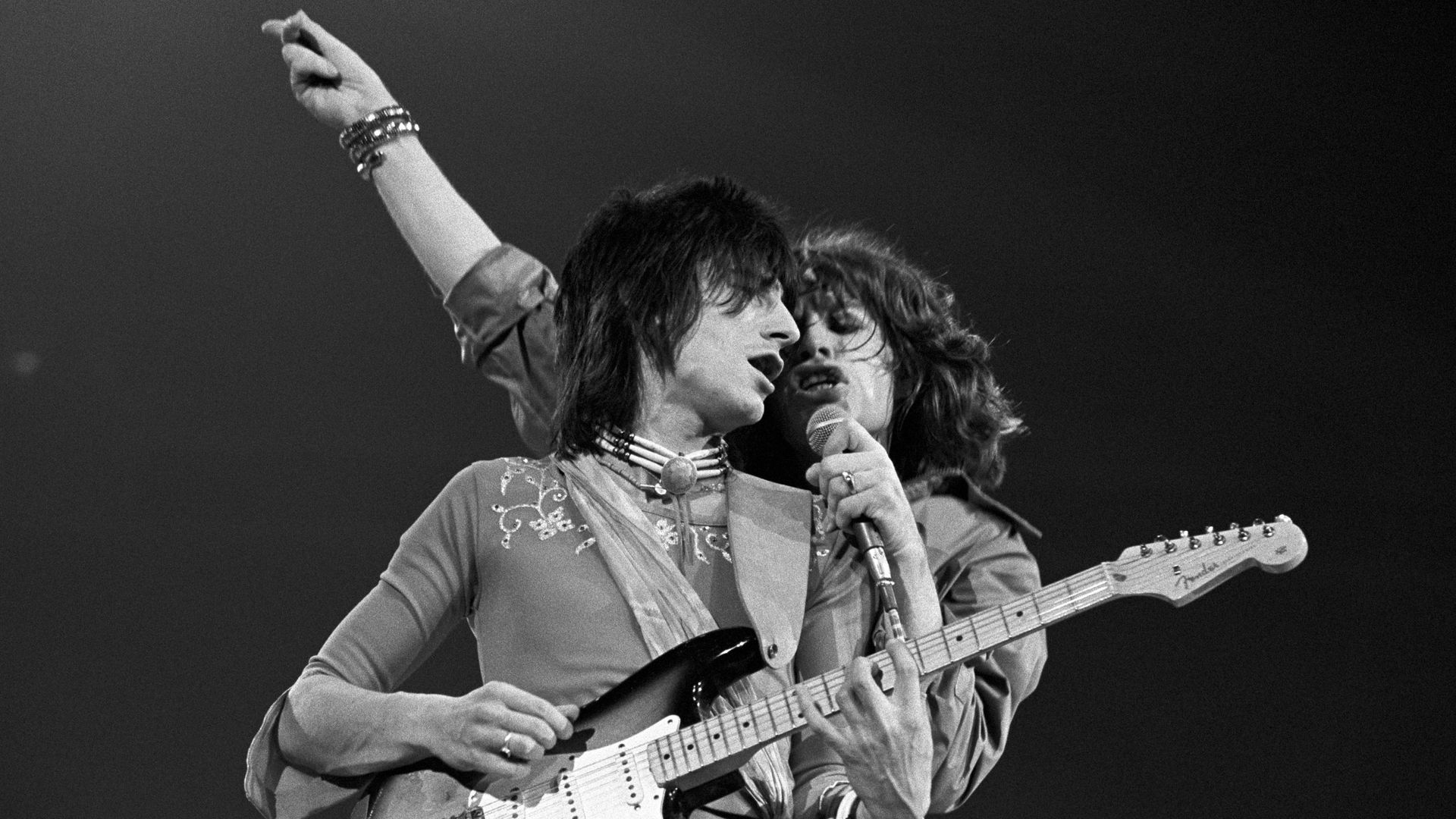 Ronnie Wood and Mick Jagger of The Rolling Stones perform in 1975.