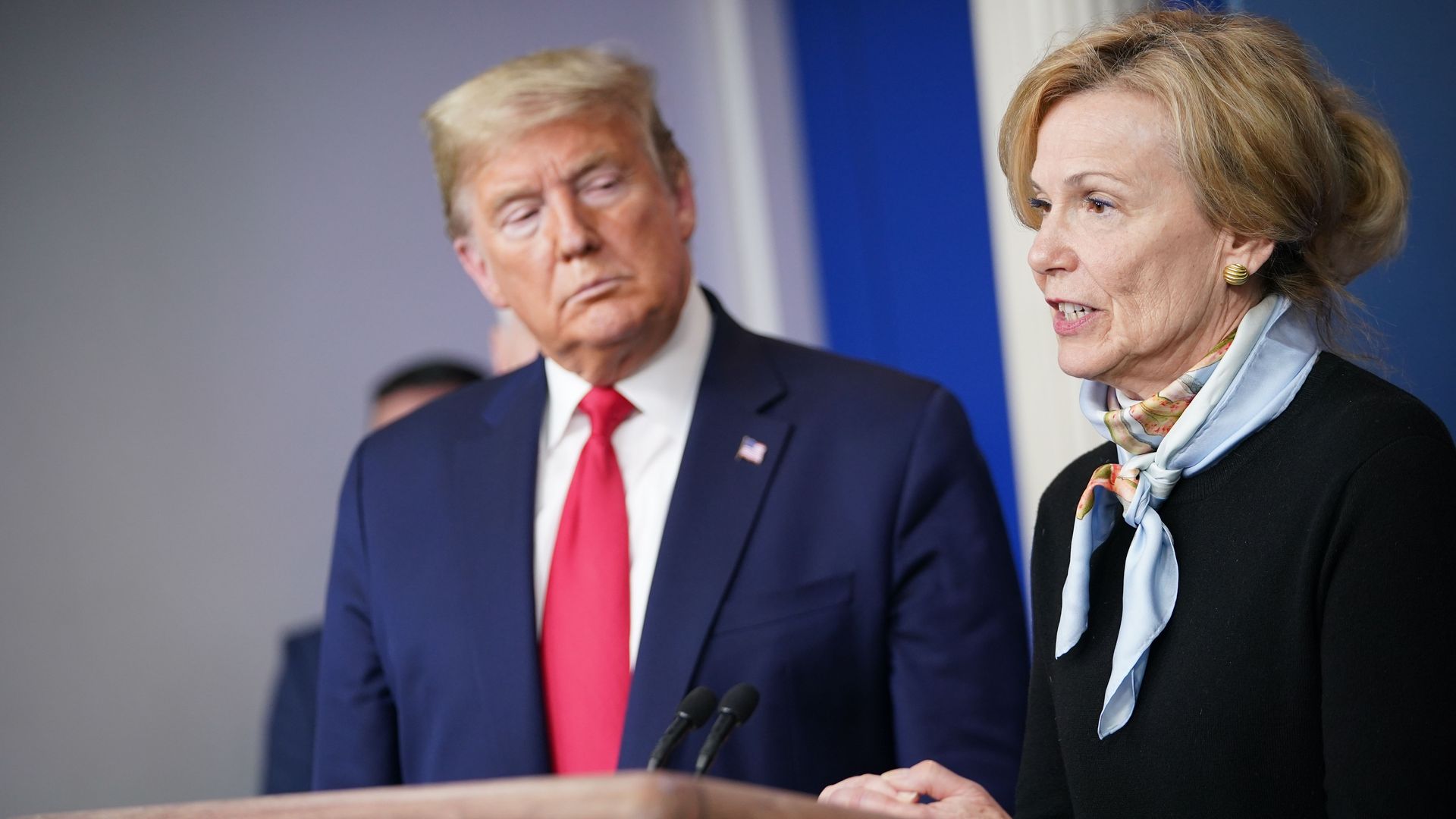 In this image, Trump and Birx stand in the White House briefing room