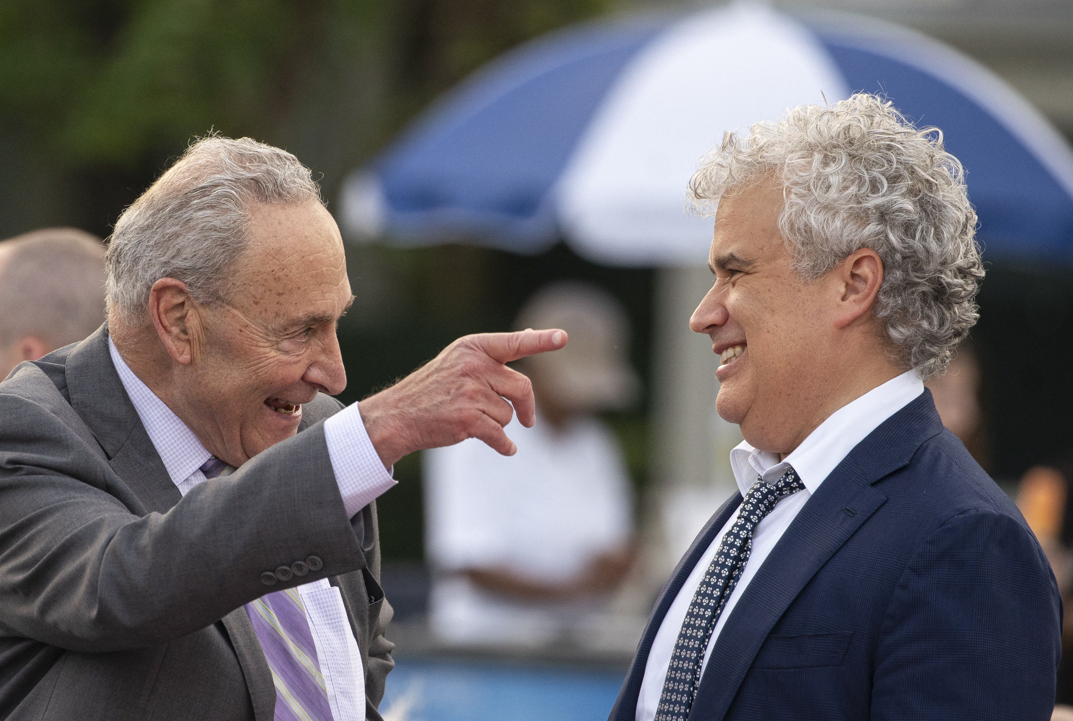 Jeff Zients (right) laughs with Senate Majority Leader Chuck Schumer during the White House Congressional Picnic on the South Lawn in June.
