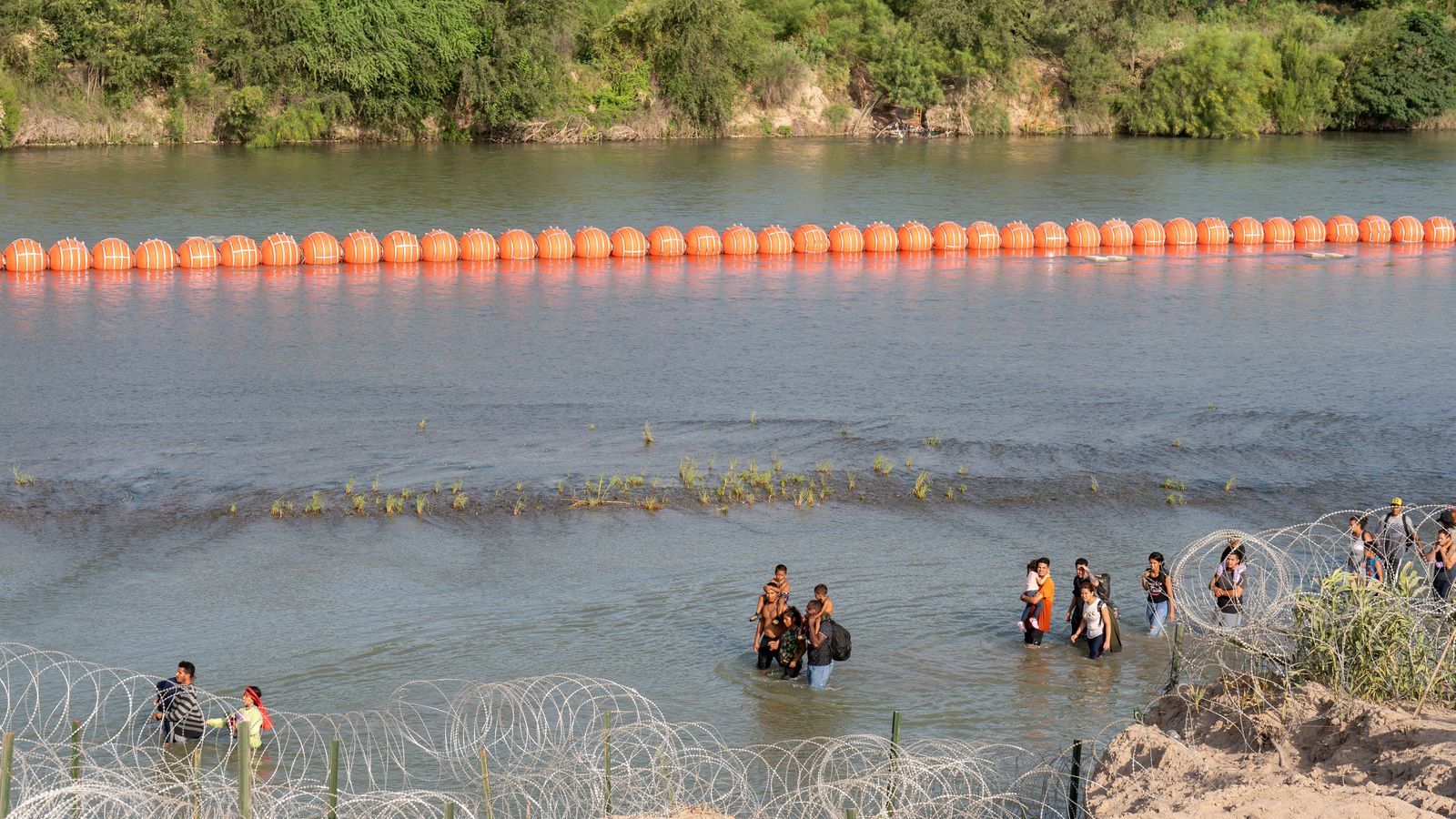 Justice Department tells Texas that floating barrier on Rio Grande