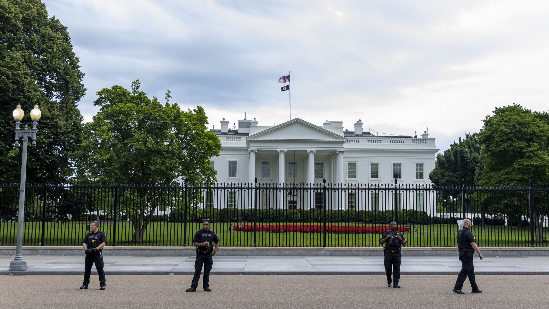 Secret Service Agents stand watch as abortion rights protesters gather at the White House to denounce the U.S. Supreme Court decision to end federal abortion rights protections on June 26, 2022.