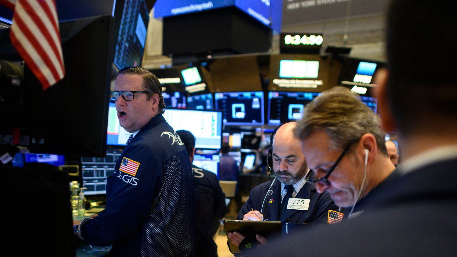 Traders work during the opening bell at the New York Stock Exchange (NYSE) on March 13, 2020 at Wall Street in New York City