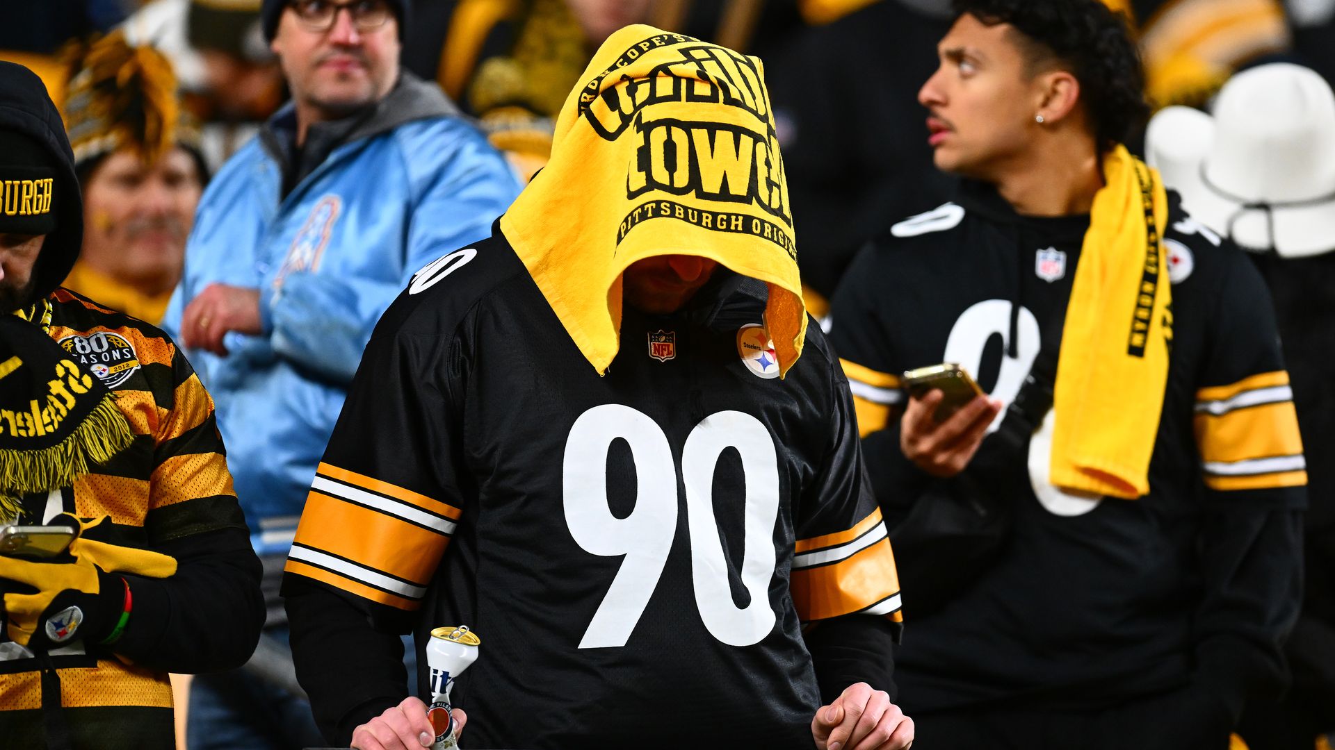  A fan, wearing a T.J. Watt #90 of the Pittsburgh Steelers jersey and a Terrible Towel on their head, reacts after losing to the Houston Texans in an NFL wild card playoff game at Acrisure Stadium on January 12, 2026 in Pittsburgh, Pennsylvania. (Photo by Joe Sargent/Getty Images)