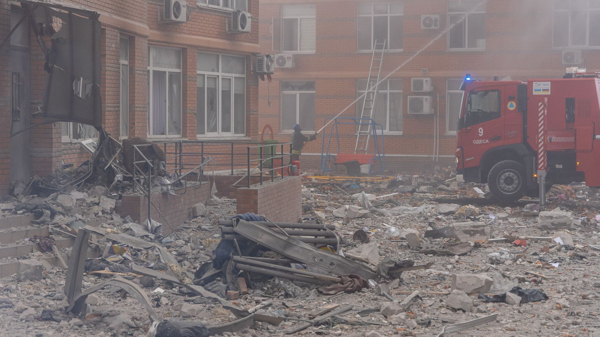 A firefighter extinguishing a fire in a high-rise building after a missile attack in Odesa on Dec. 29.