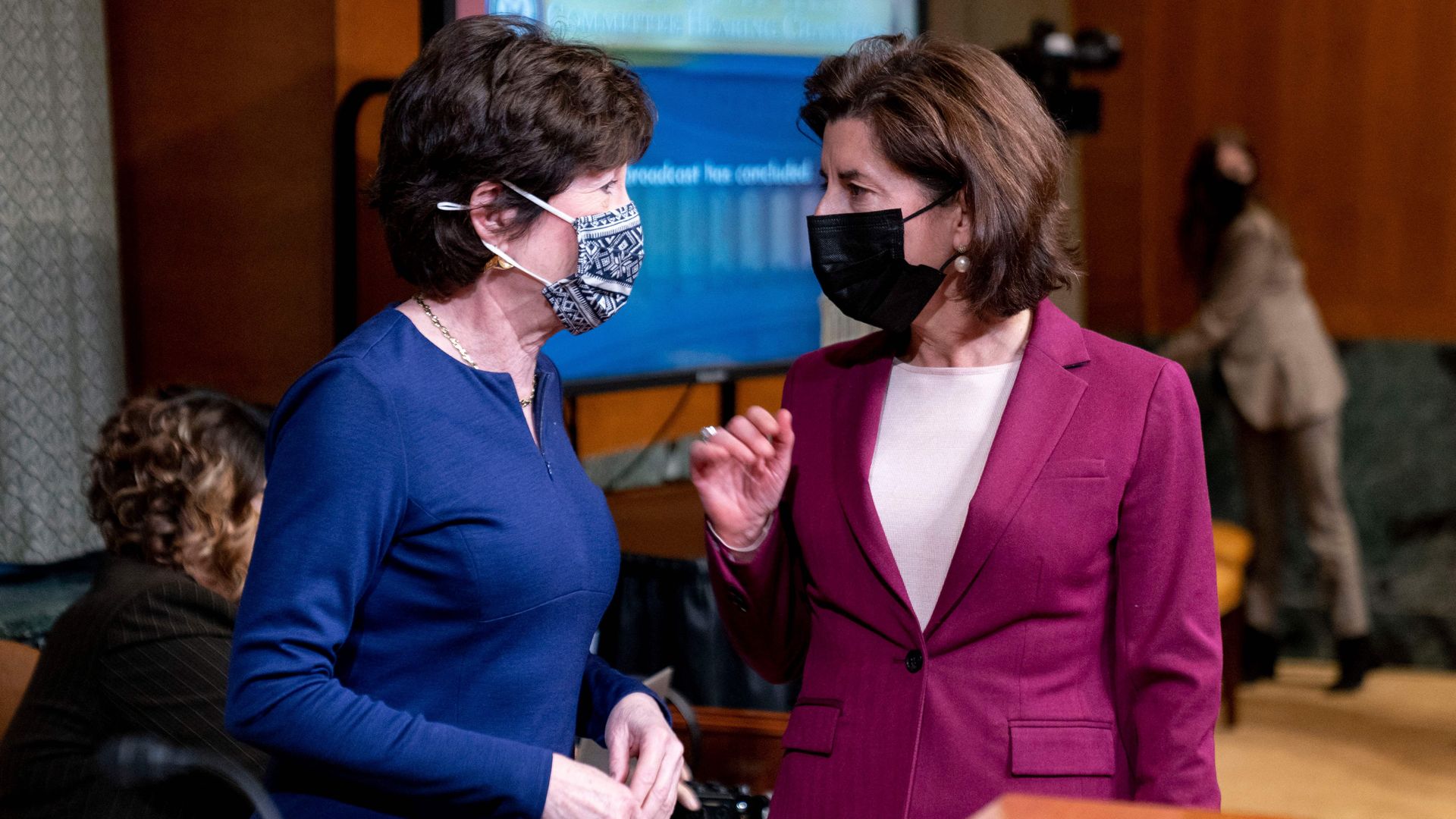 Commerce Secretary Gina Raimondo is seen speaking with Sen. Susan Collins.