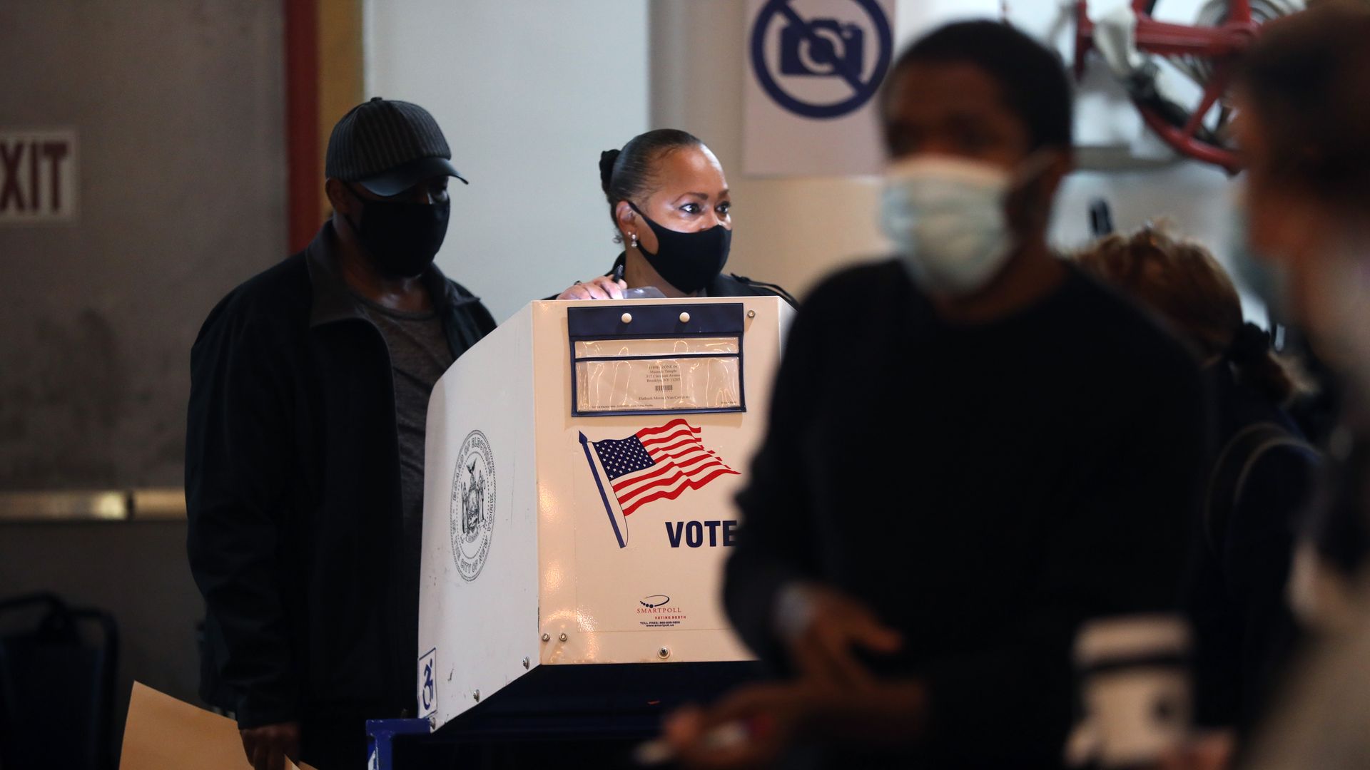 People vote at a Masonic temple in Brooklyn