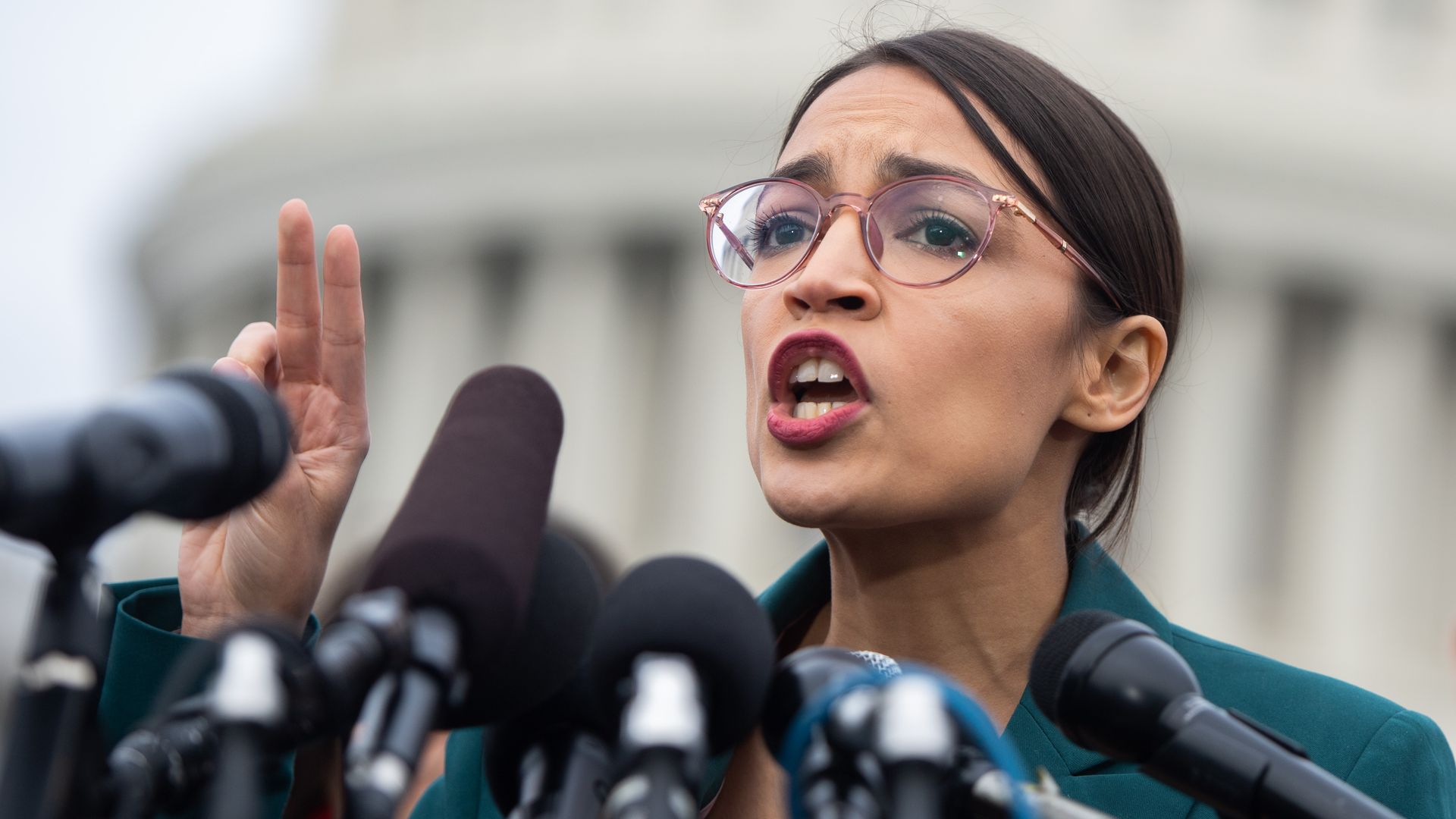 AOC describing the Green New Deal in front of Capitol Building