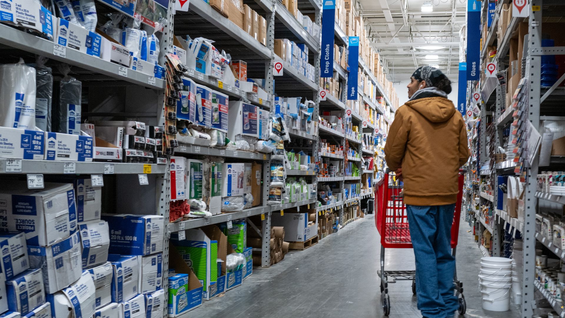 Shopper in aisle of a home improvement store