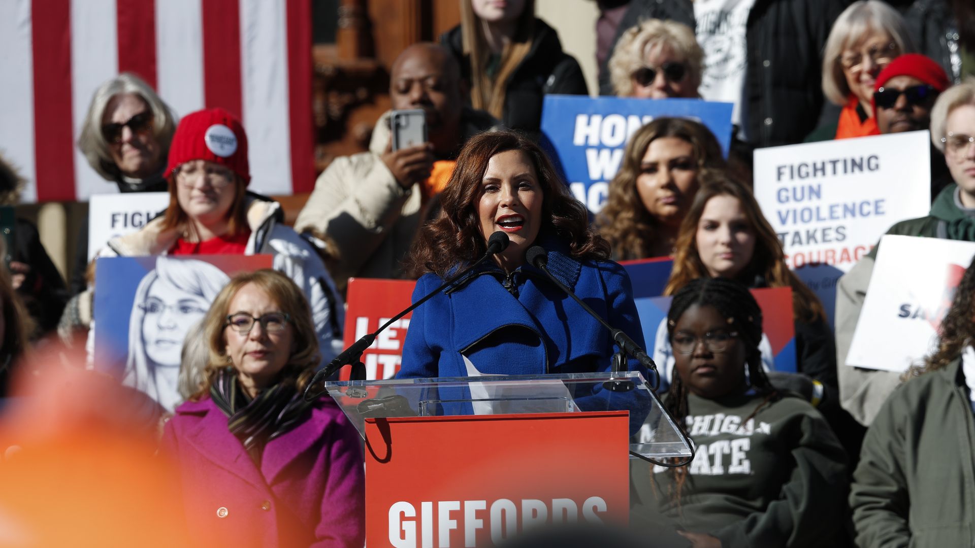 Gov. Gretchen Whitmer speaks alongside former US Rep. Gabby Giffords at a gun violence rally in Lansing last week. (Photo: Chris DuMond/Getty)