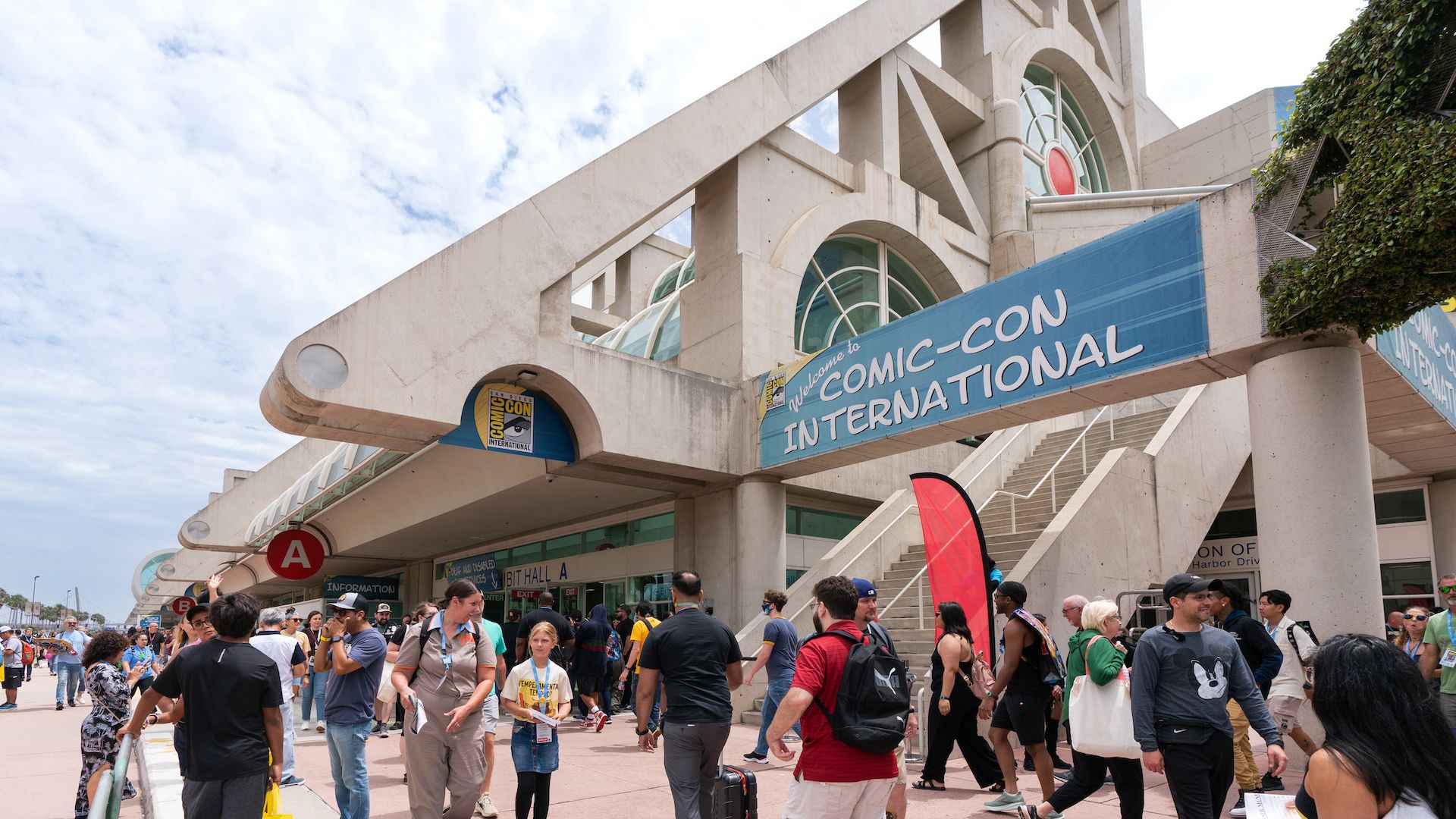 Crowds of people walk around the San Diego Convention Center, which hosts Comic-Con International.