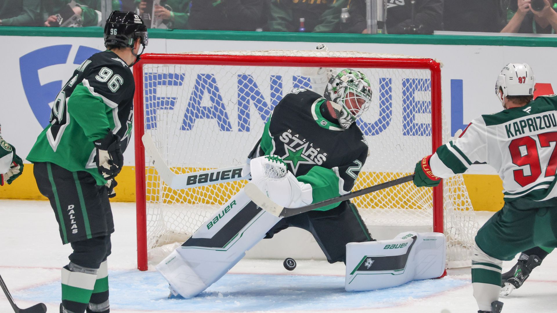 Dallas Stars goaltender Jake Oettinger gives up a goal against the Minnesota Wild.