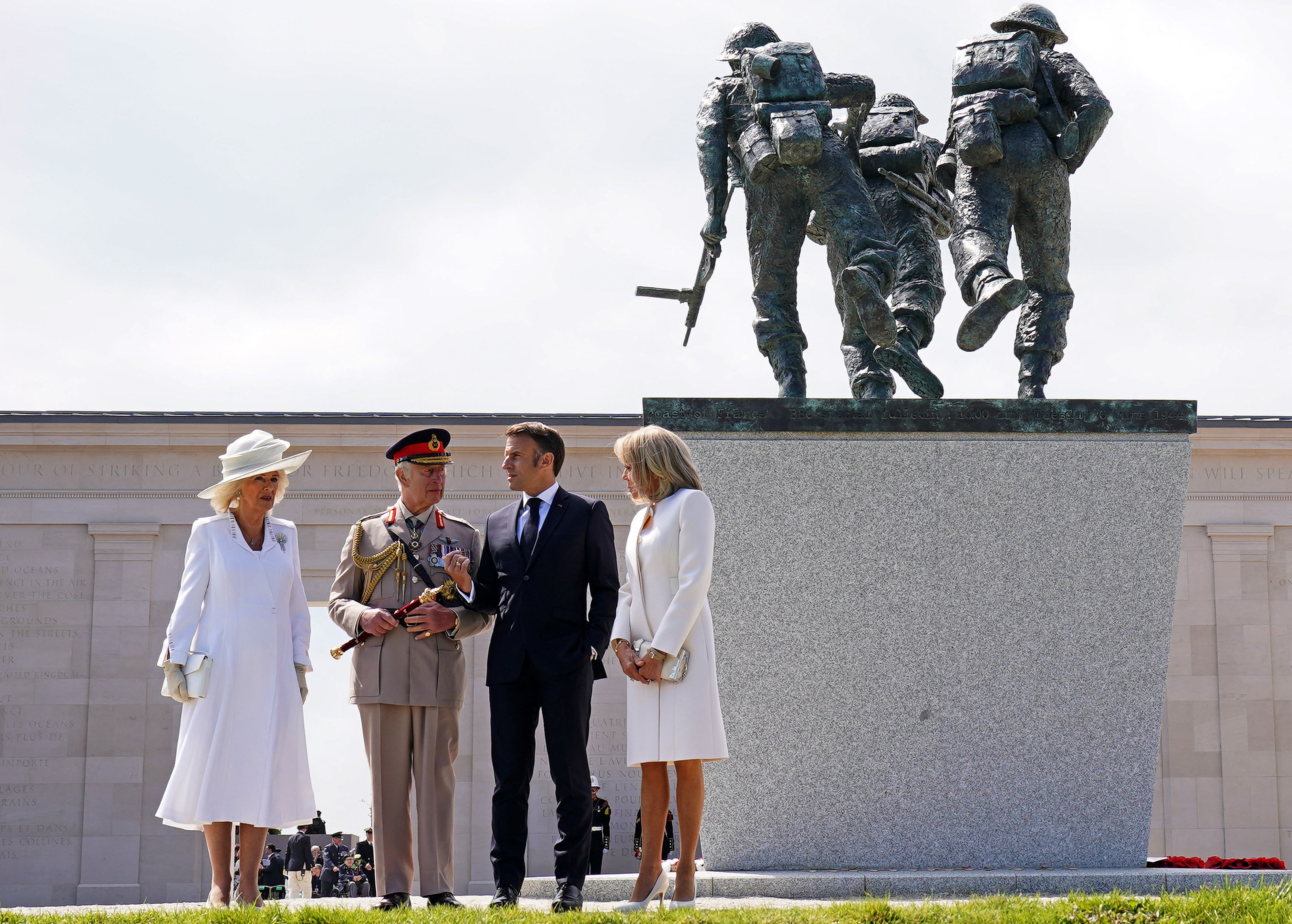 Britain's King Charles III, Britain's Queen Camilla, France's President Emmanuel Macron and his wife Brigitte Macron at a memorial near Ver-sur-Mer, France, on June 6.