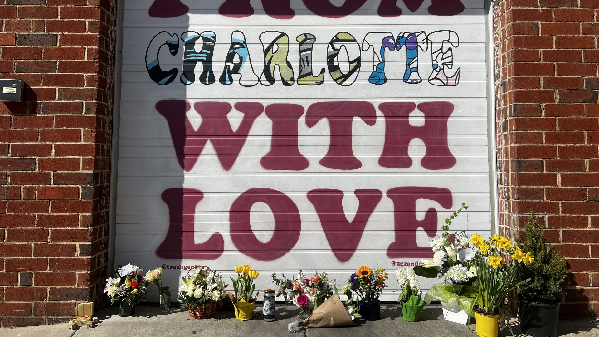 Flowers outside Wooden Robot