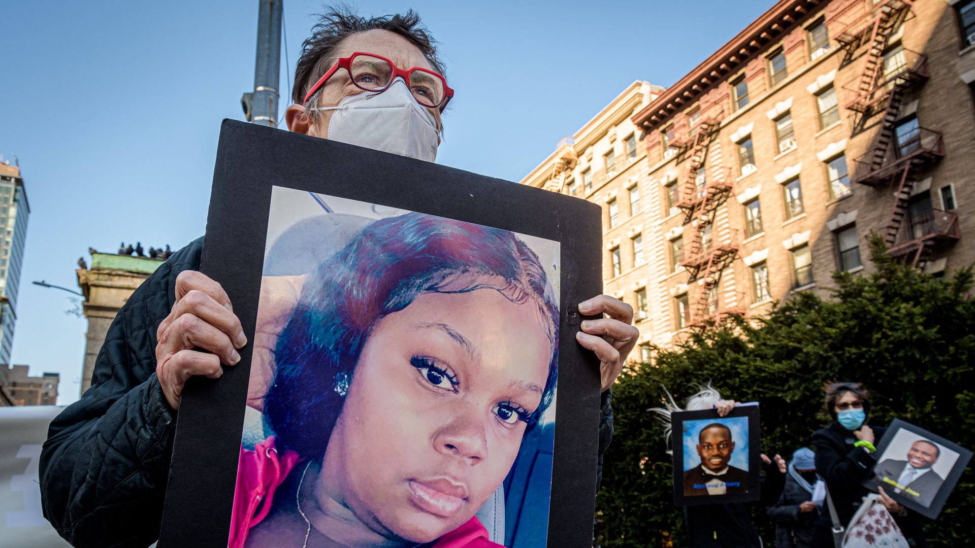 A person holding a portrait of Breonna Taylor at a demonstration In New York City in April 2021. 