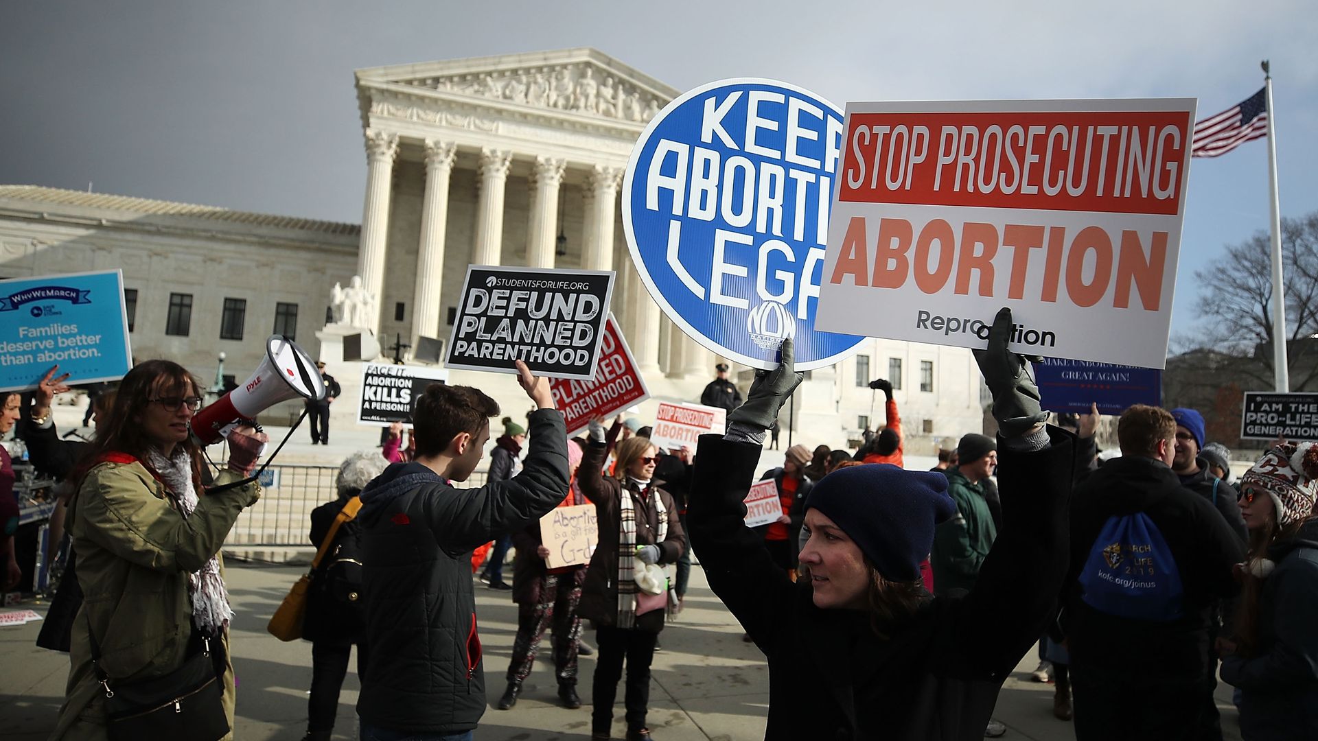 Supporters of legal access to abortion, as well as anti-abortion activists, rally outside the Supreme Court. 