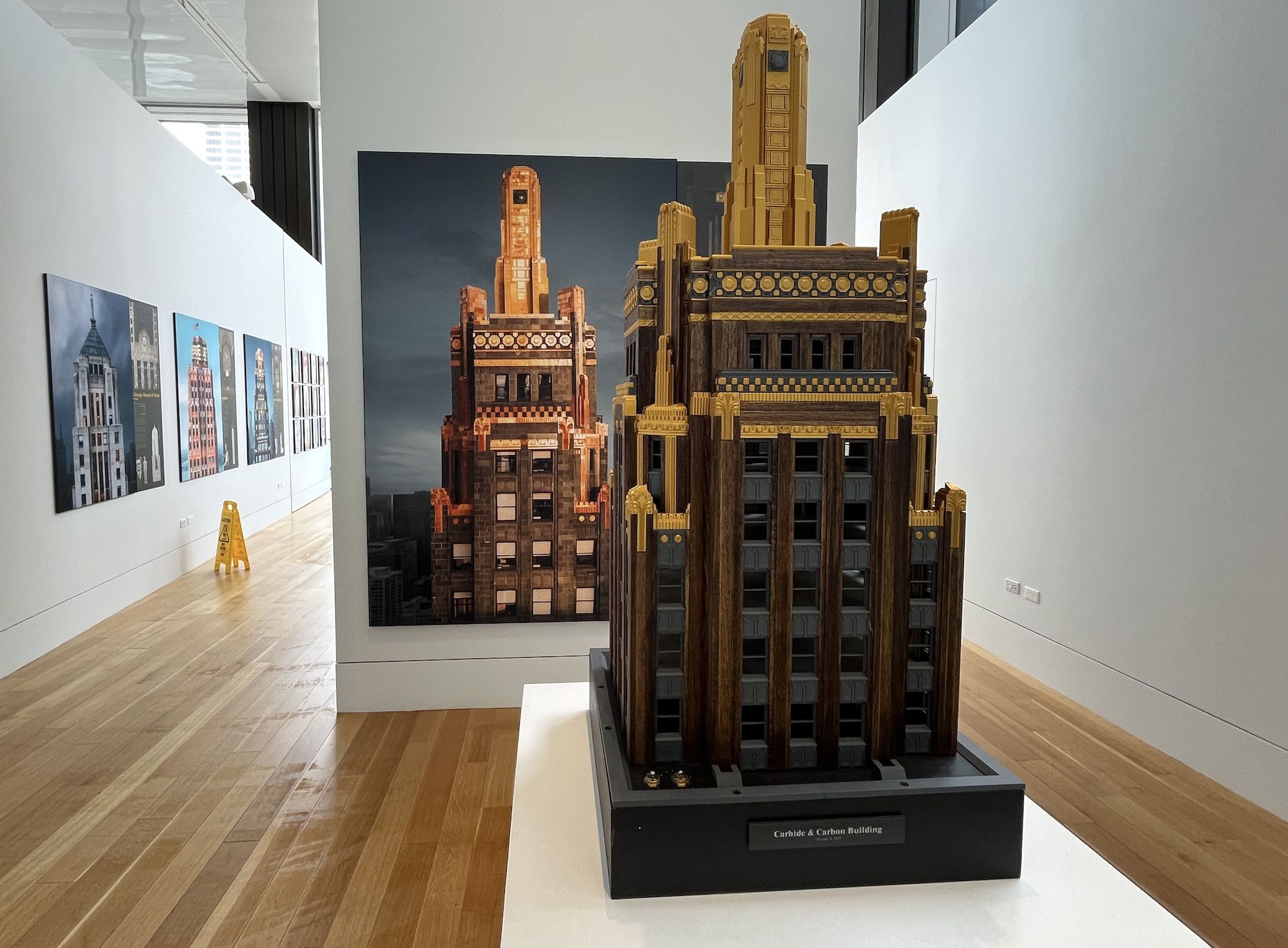 Model of Cabide and Carbon building on a pedestal in front of a large photograph of the building. 
