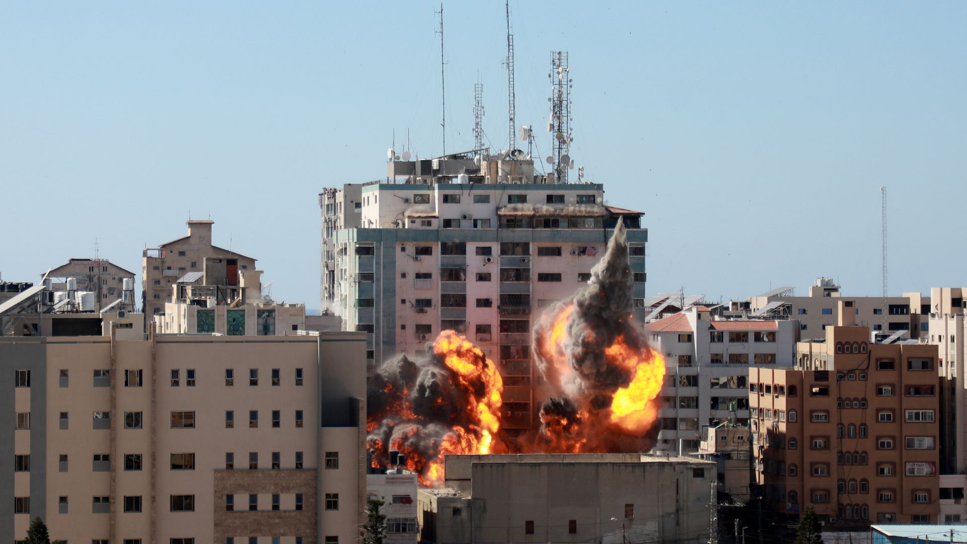 Picture of Jala Tower on fire and on the verge of collapse. It housed media offices of Associated Press, Al Jazeera and others