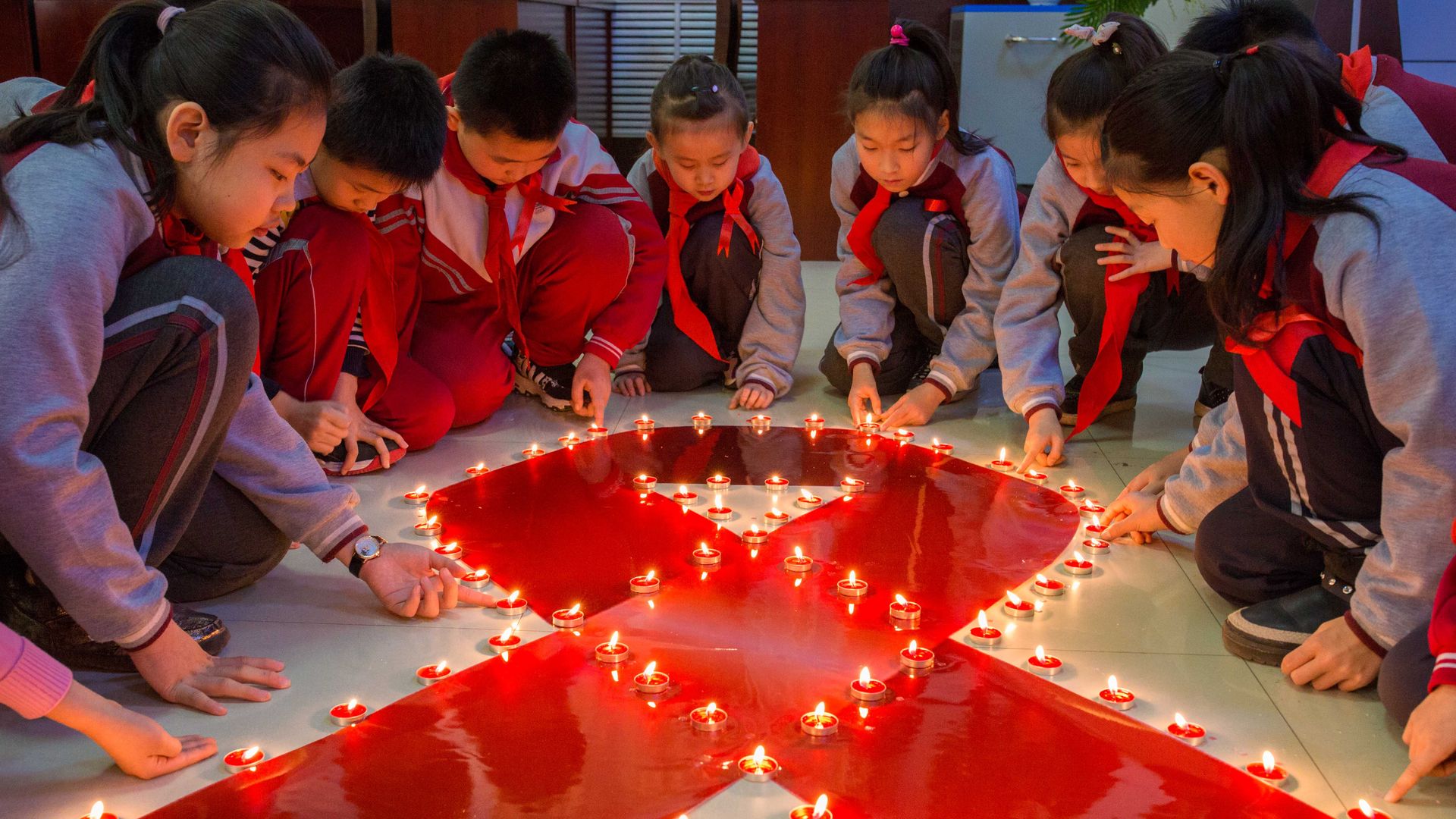 Chinese students lighting candles