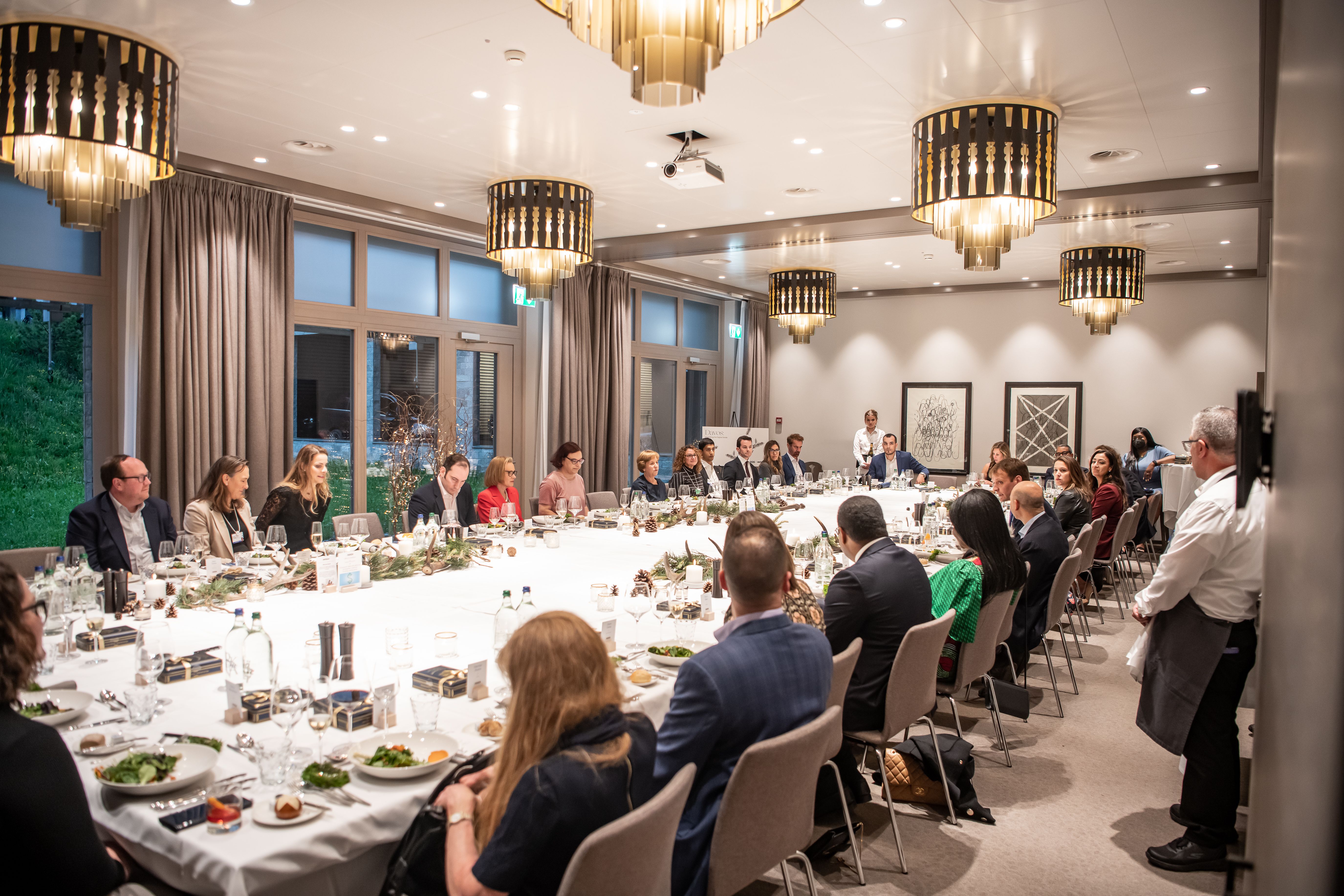 Participants enjoyed a seated dinner during the discussion.