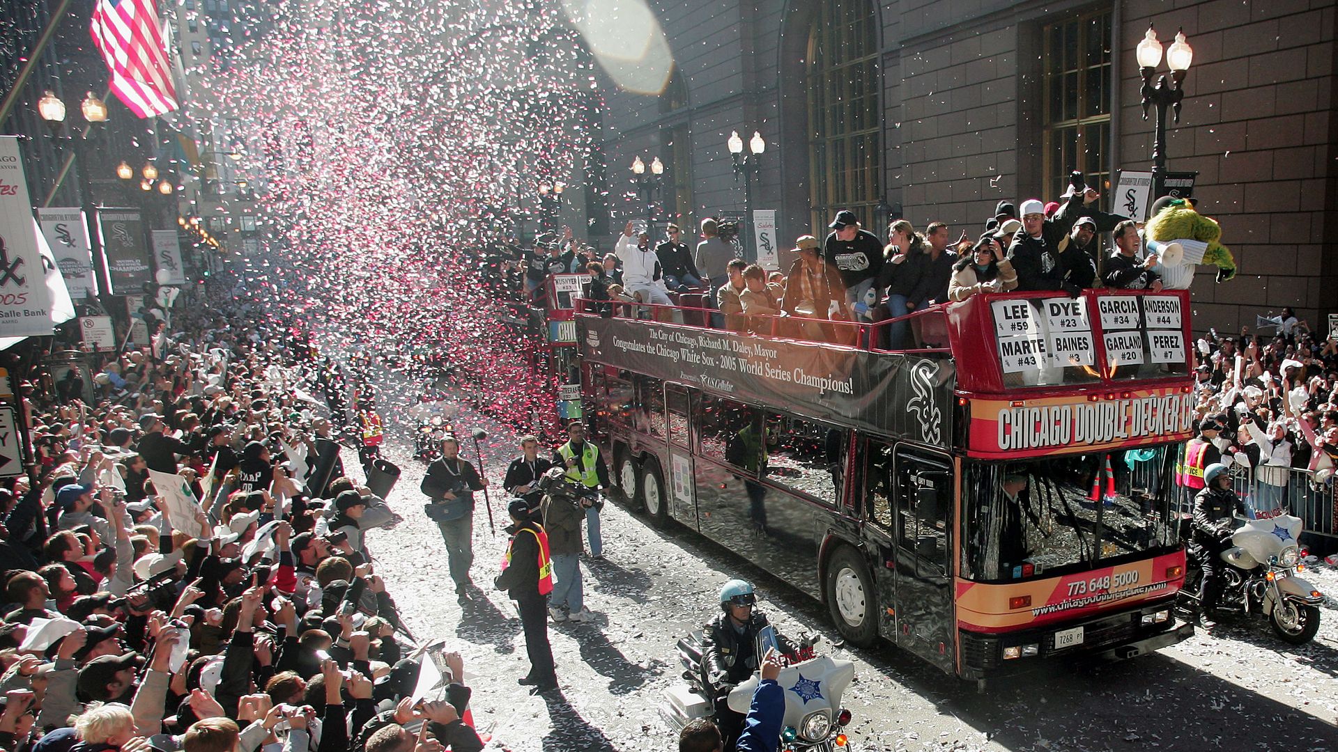 Photo of confetti thrown from a bus during a victory parade