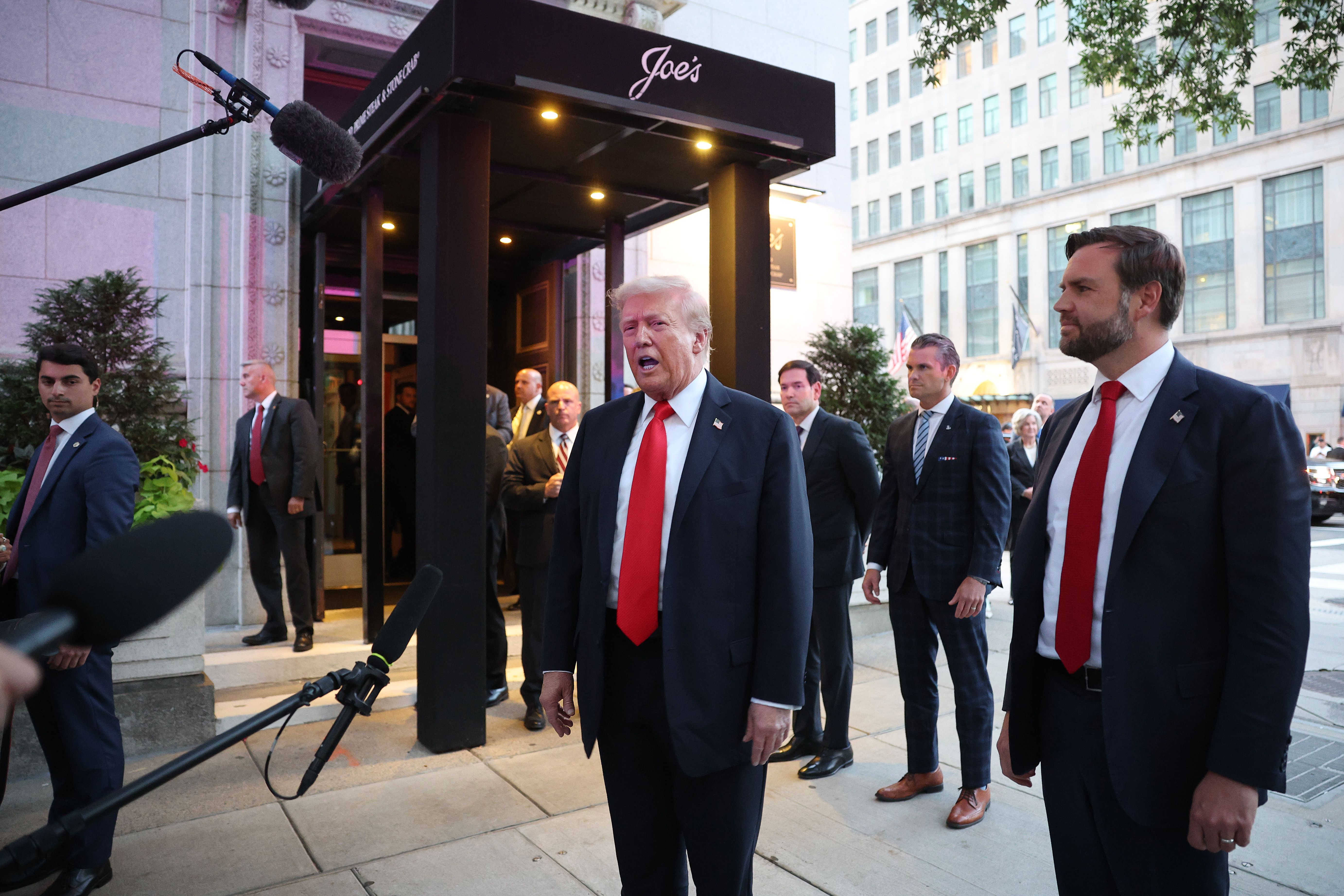 President Trump and members of his administration arrive to eat dinner at Joe's Seafood, Prime Steak & Stone Crab near the White House last night.