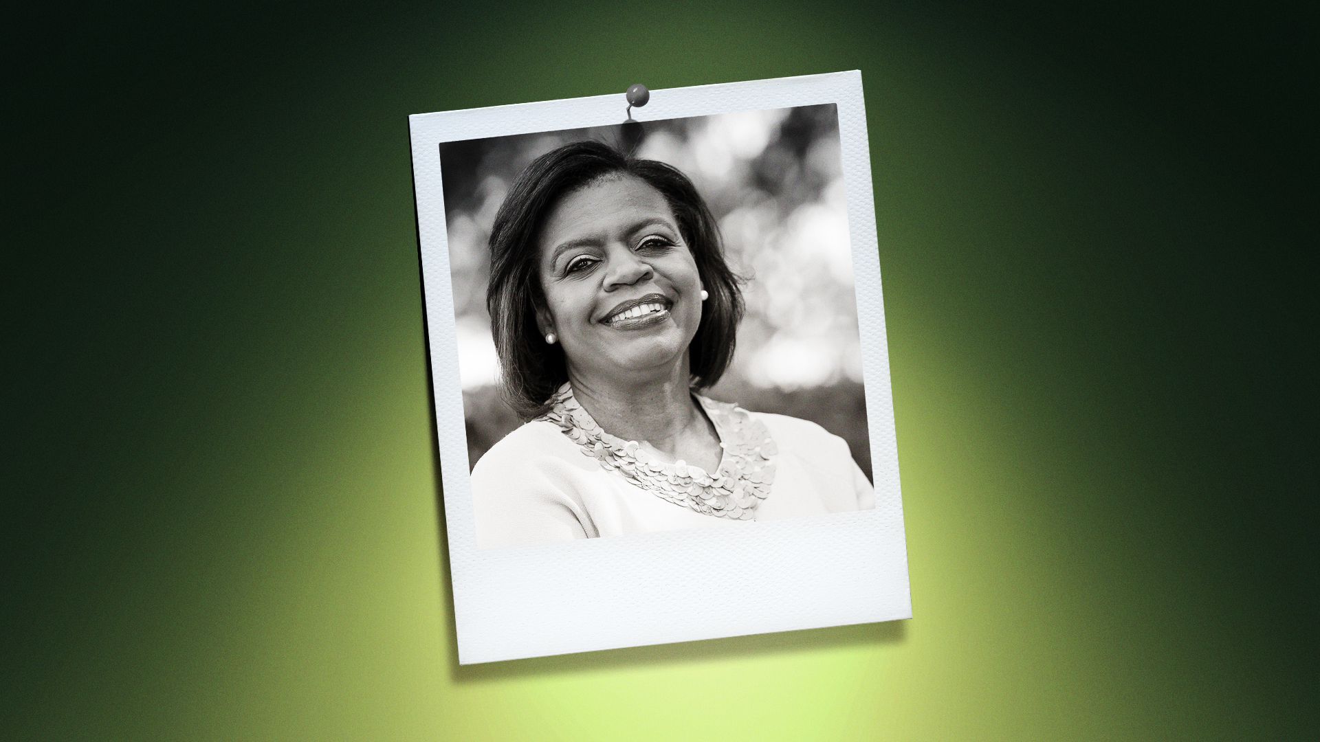 Photo illustration of Cheri Beasley in the center of a Polaroid photo under a green spotlight.