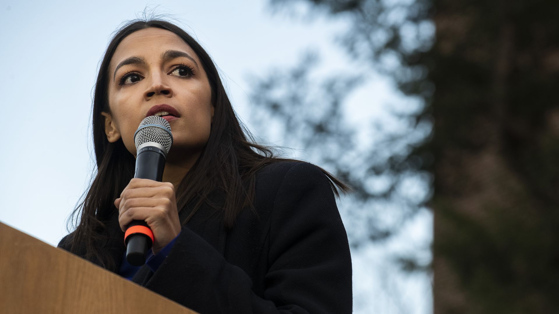 Rep. Alexandria Ocasio-Cortez addresses supporters during a campaign rally for Democratic presidential candidate Sen. Bernie Sanders on March 8