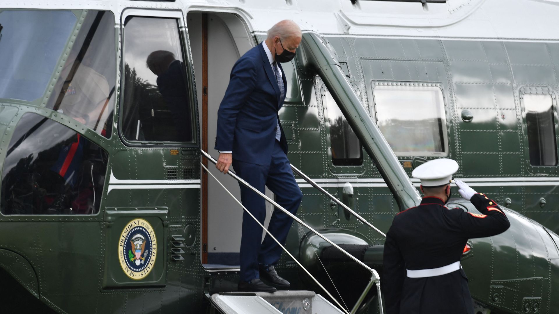 President Biden is seen disembarking from Marine One after returning to Washington on Monday.