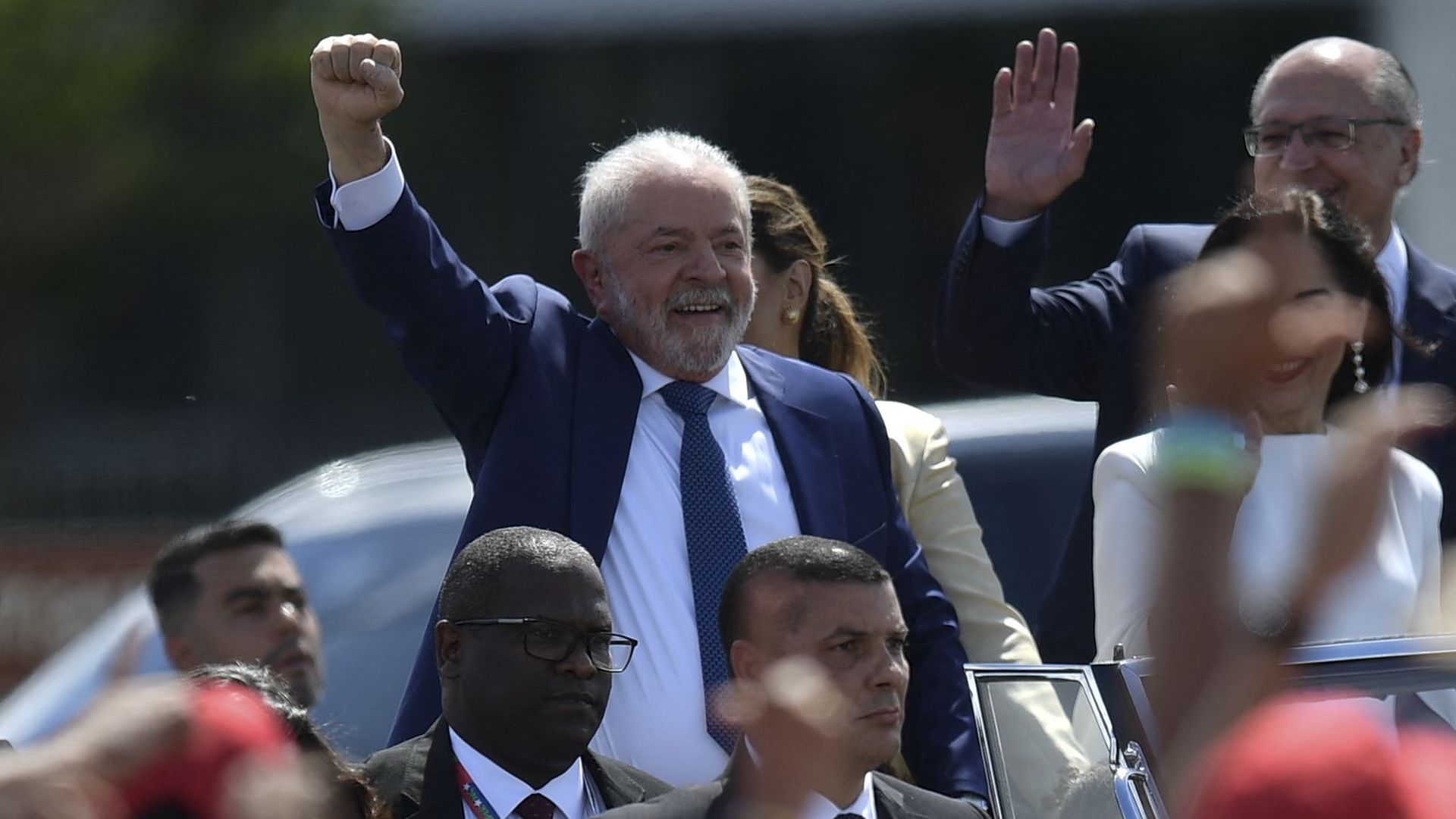 Luiz Inácio Lula da Silva smiles and has his fist in the air during his inauguration