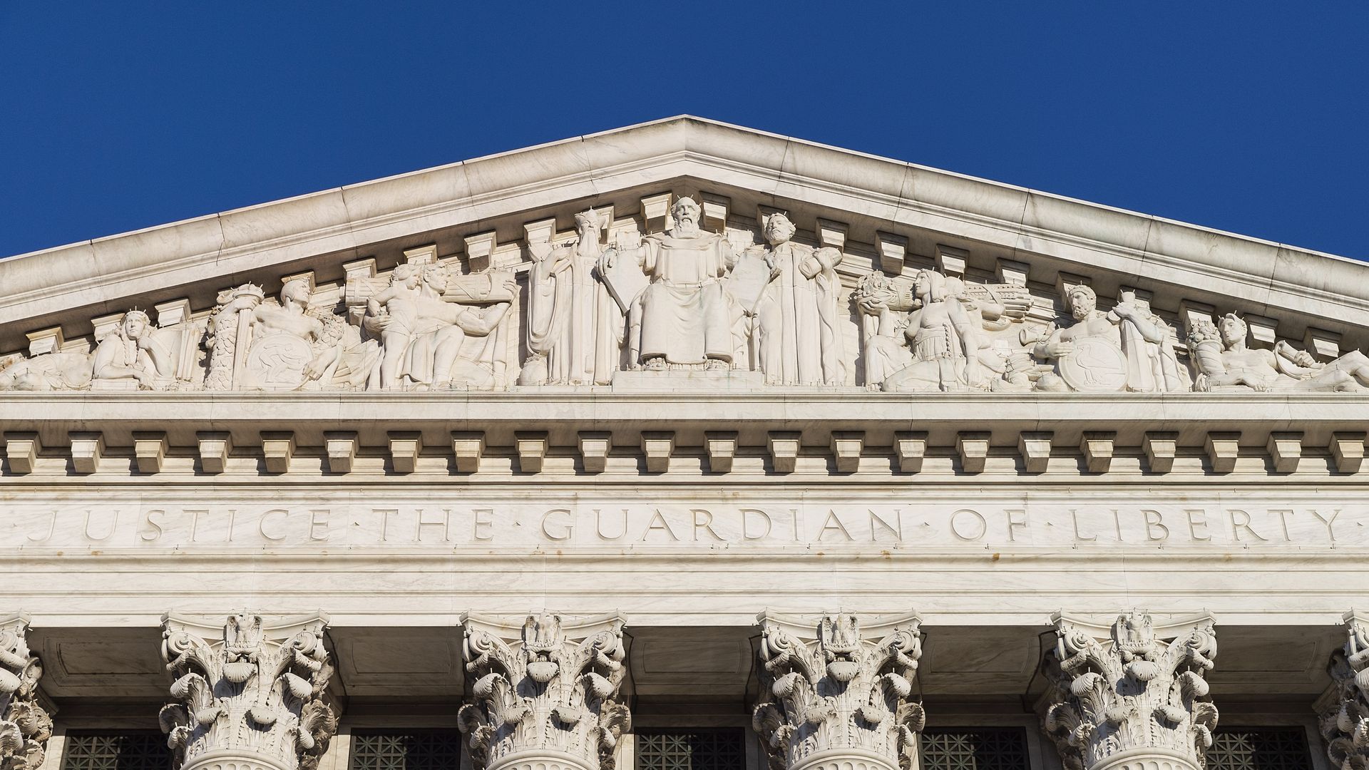 Photo of top of Supreme Court building calling for justice and equality for all