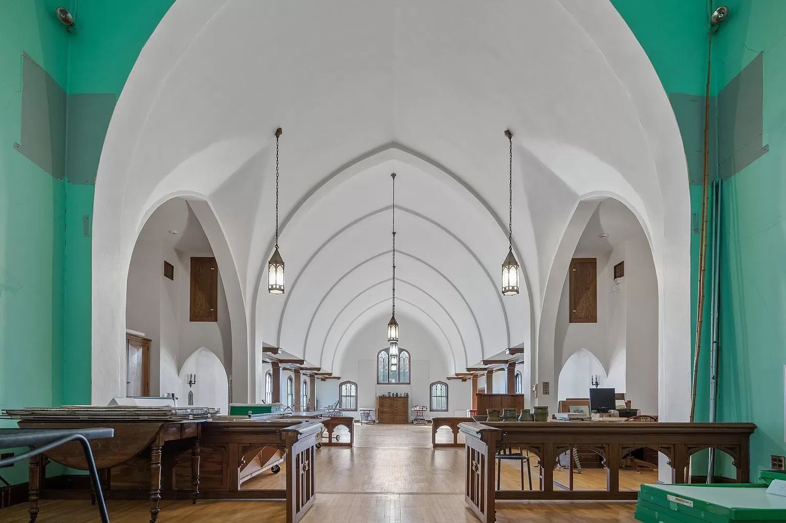 A church sanctuary with teal and white walls.