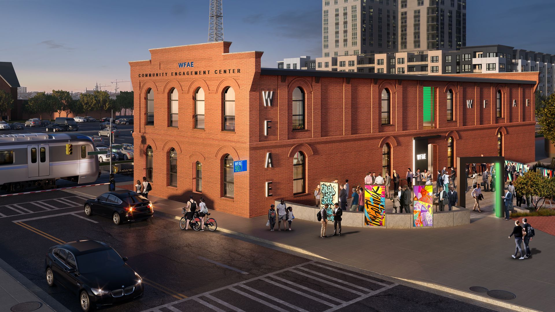 two-story brick building adjacent to a light rail line
