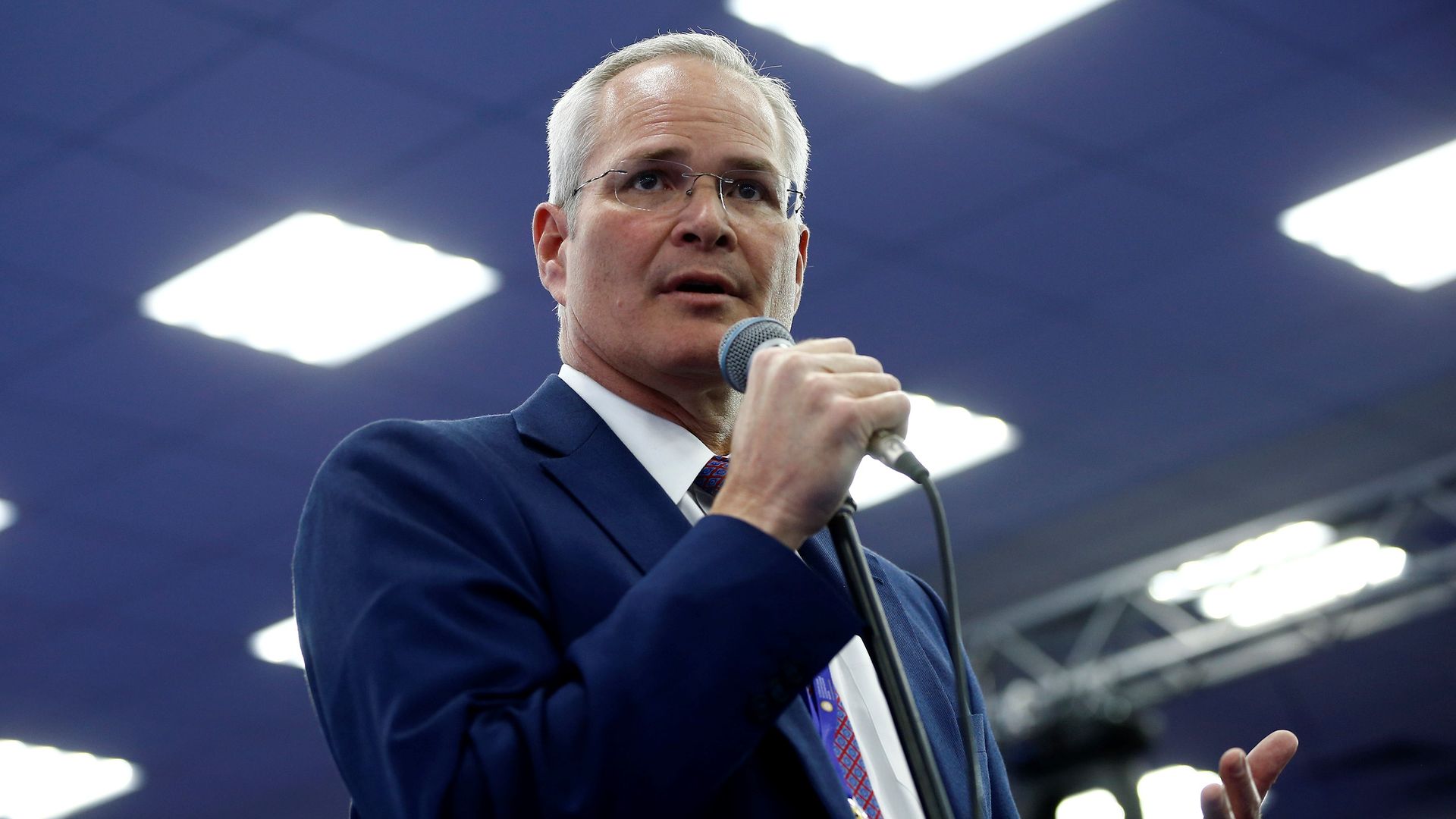 ExxonMobil CEO Darren Woods speaking at a conference in 2017