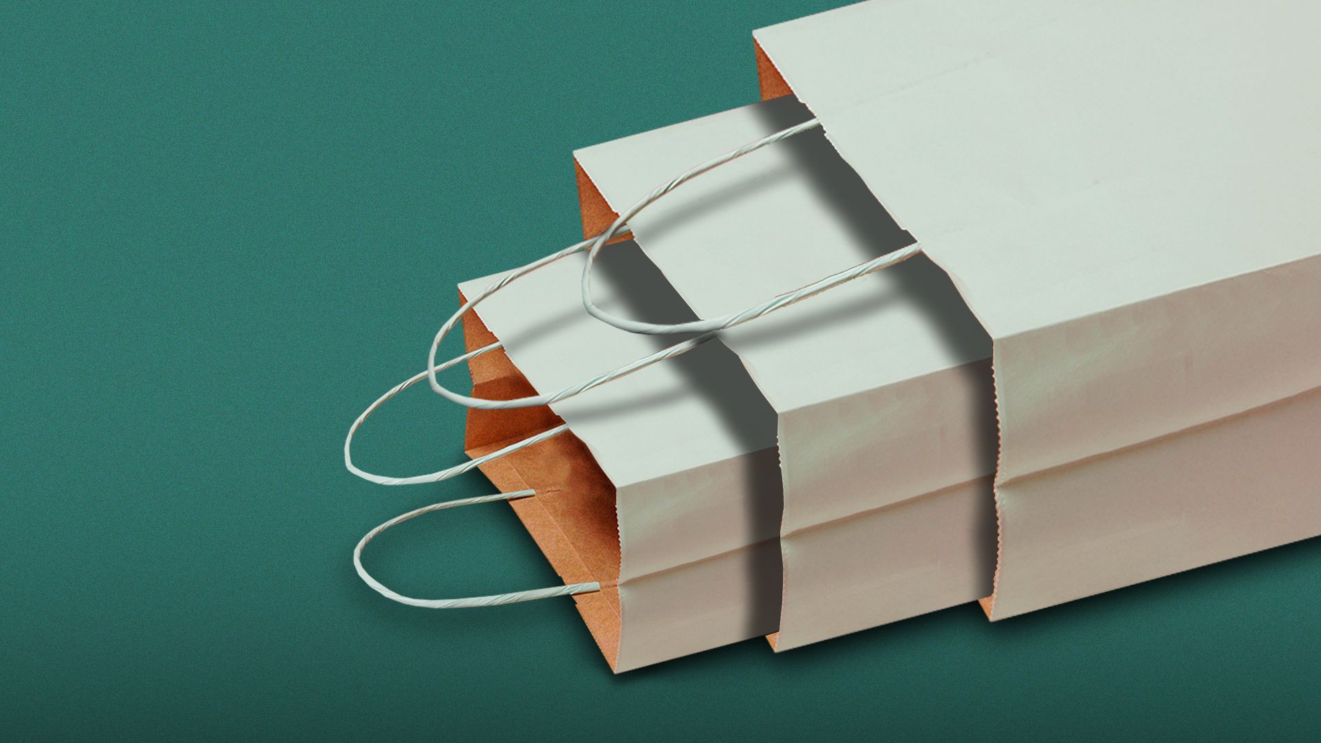 Illustration of a large blue paper shopping bag laying on its side with two other smaller, identical shopping bags falling out