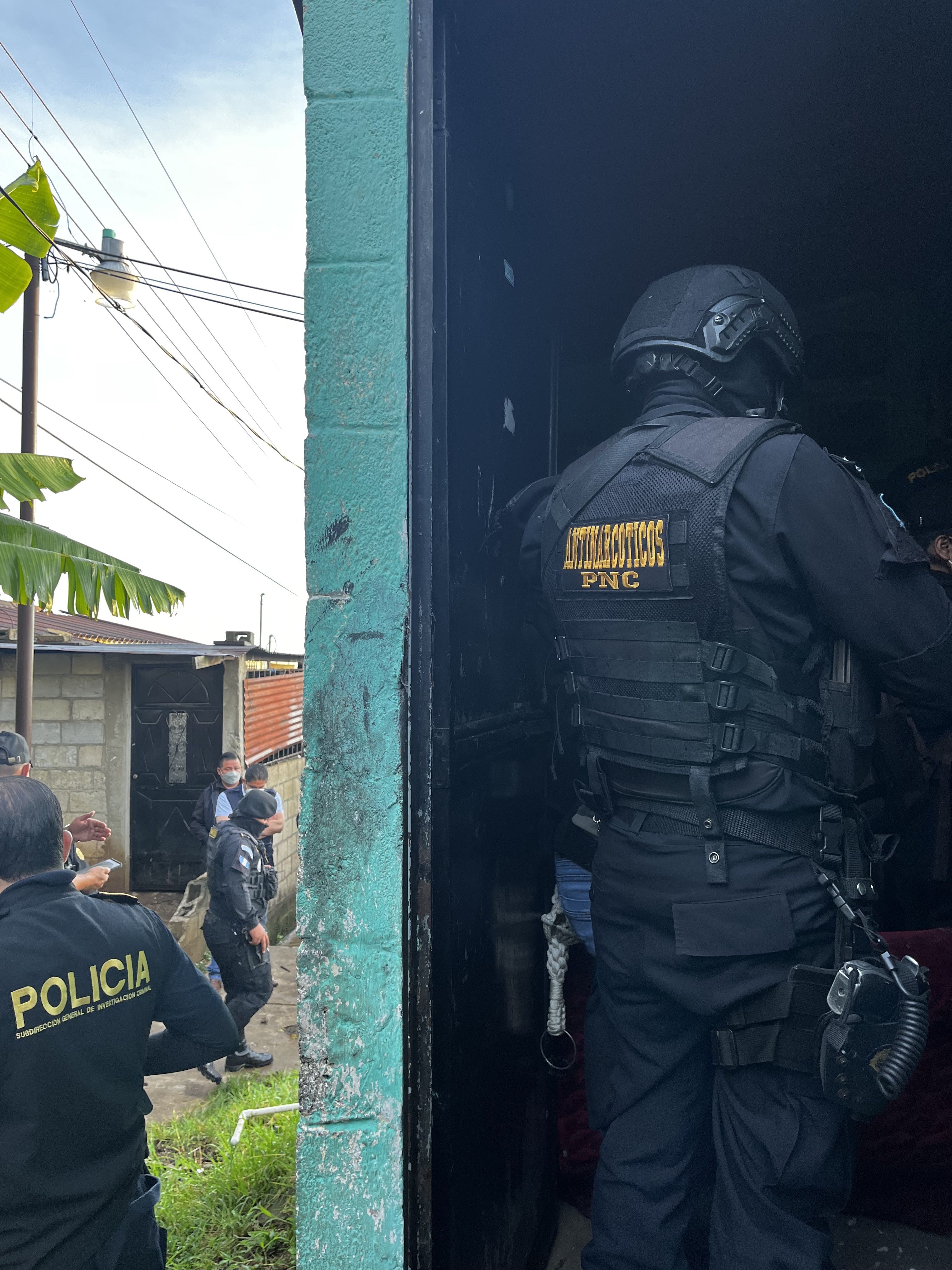 Guatemalan anti-narcotics agent conducts a search in the Ciudad Quetzal 