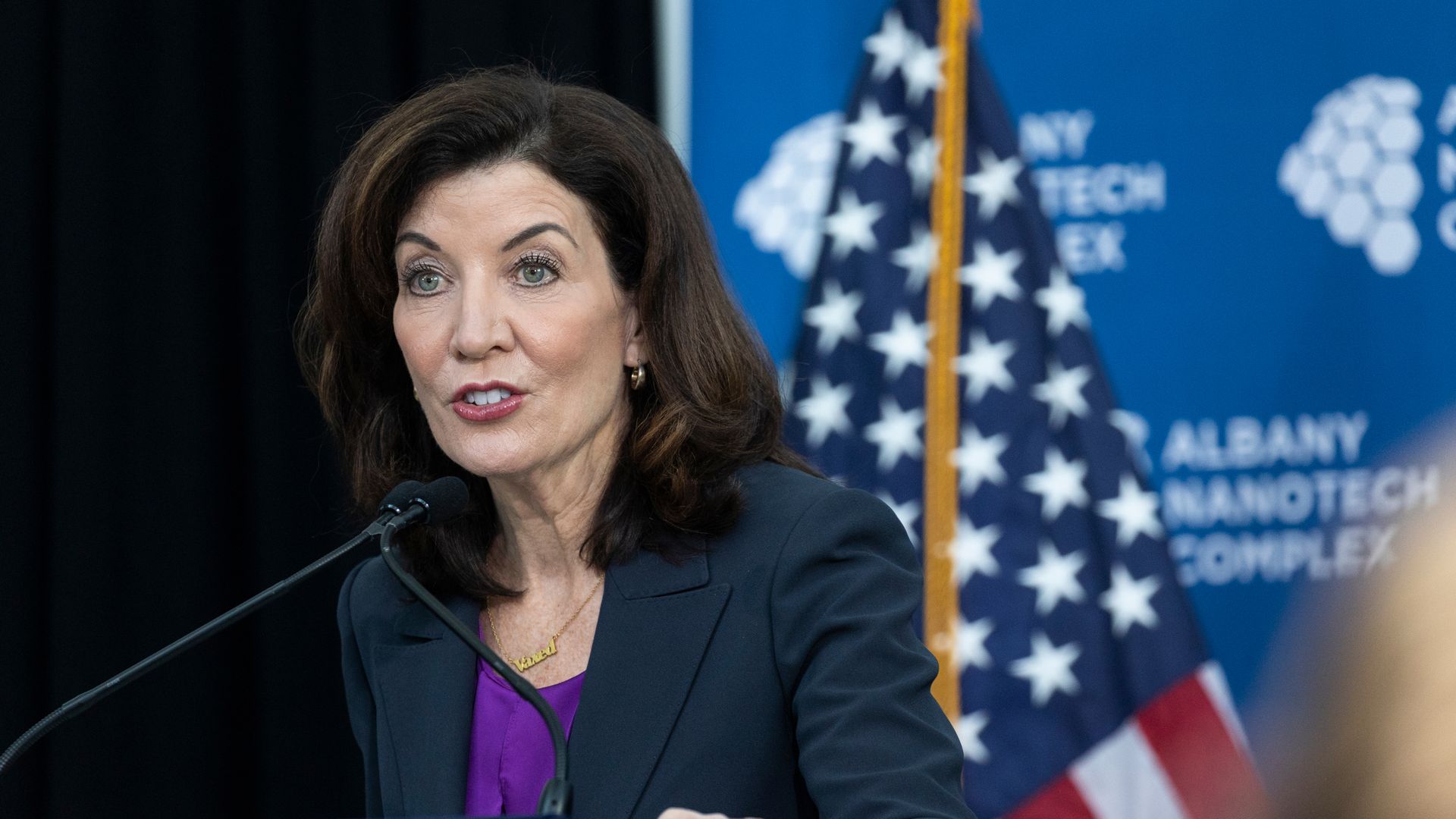 Photo of Kathy Hochul speaking from a podium