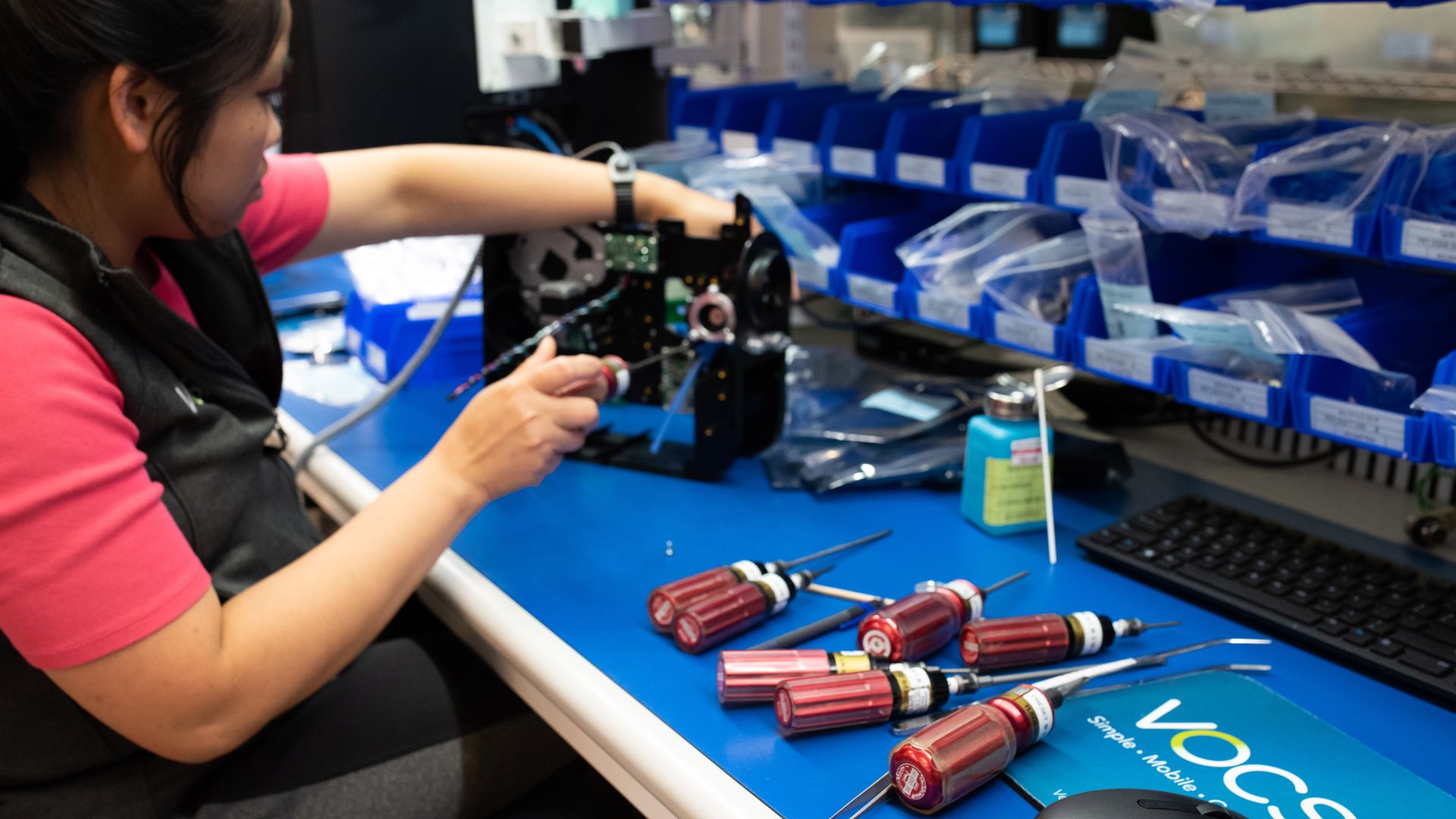 Image of a woman making a Ventec ventilator