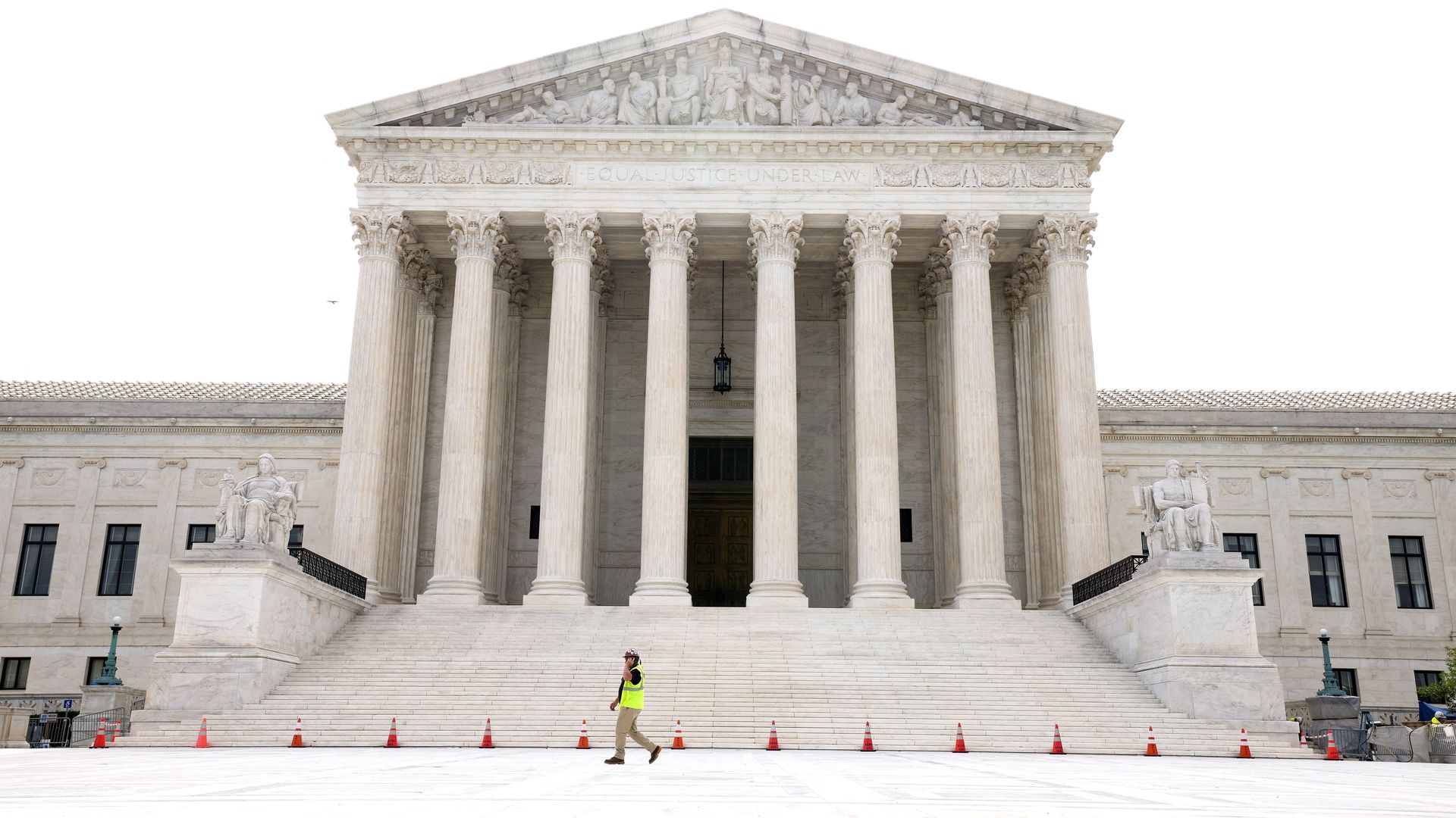 A worker walks on the plaza of the U.S. Supreme Court on June 10, 2021 in Washington, DC.