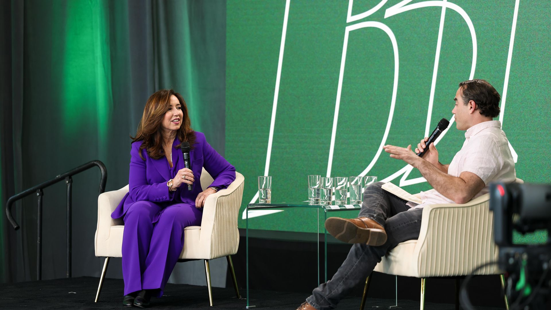 Carnival Cruise President Christine Duffy (left) speaks to Axios' Dan Primack (right)