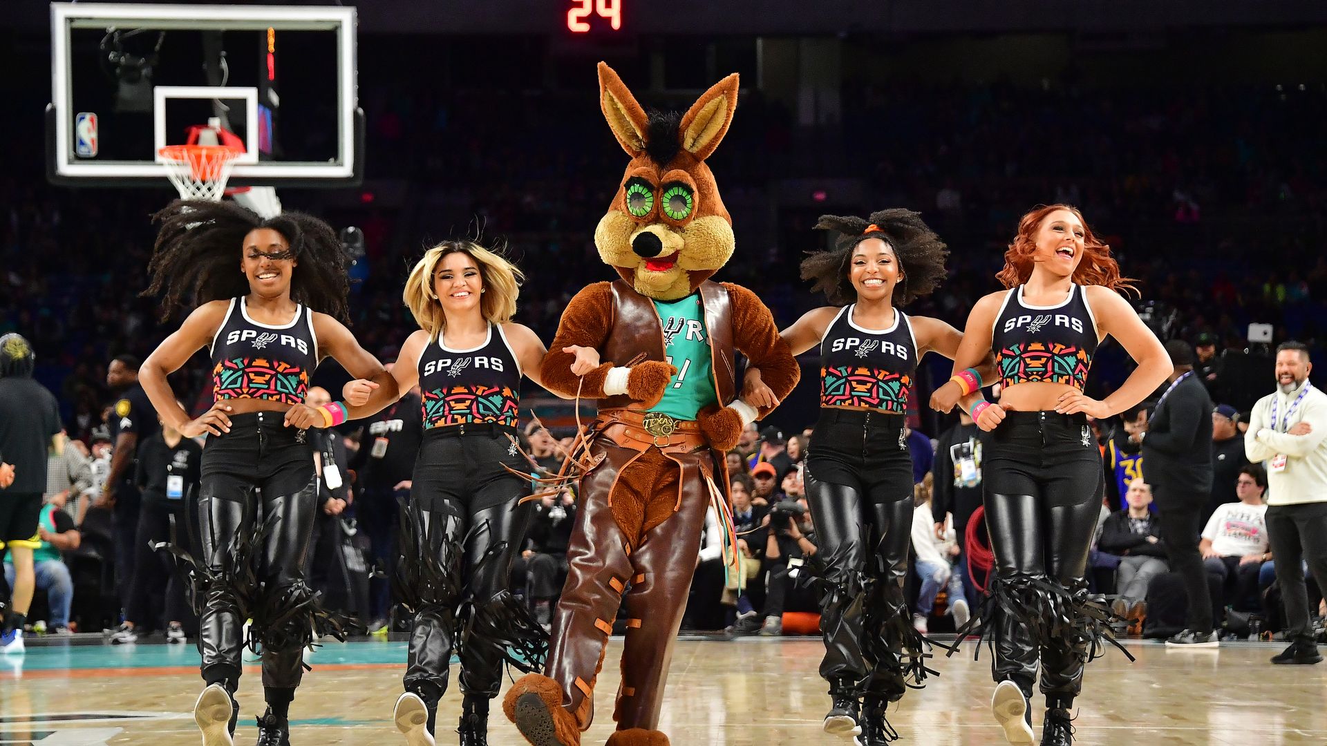 The Spurs' mascot Coyote dances with members of the San Antonio Spurs Hype Squad.