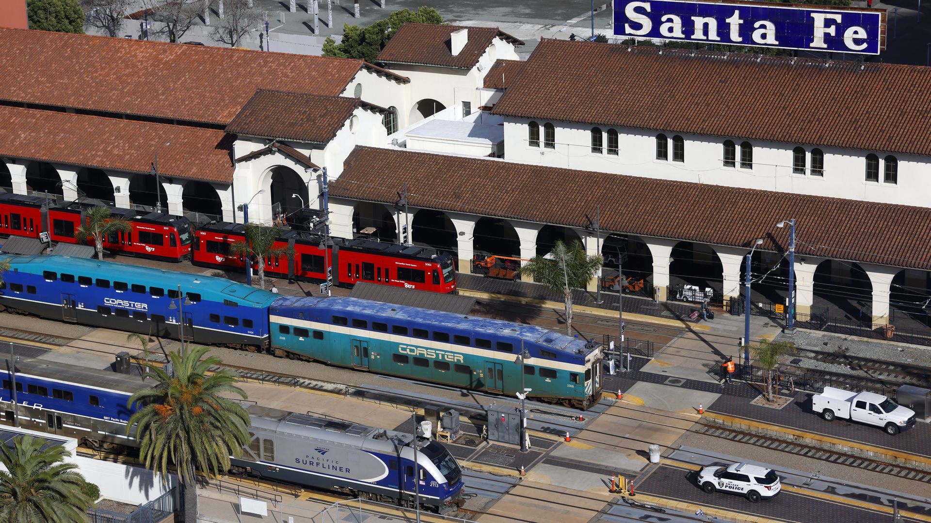 Santa Fe Depot, in downtown San Diego, with an Amtrak Surfliner train, an NCTD Coaster and an MTS Trolley all in the station together.