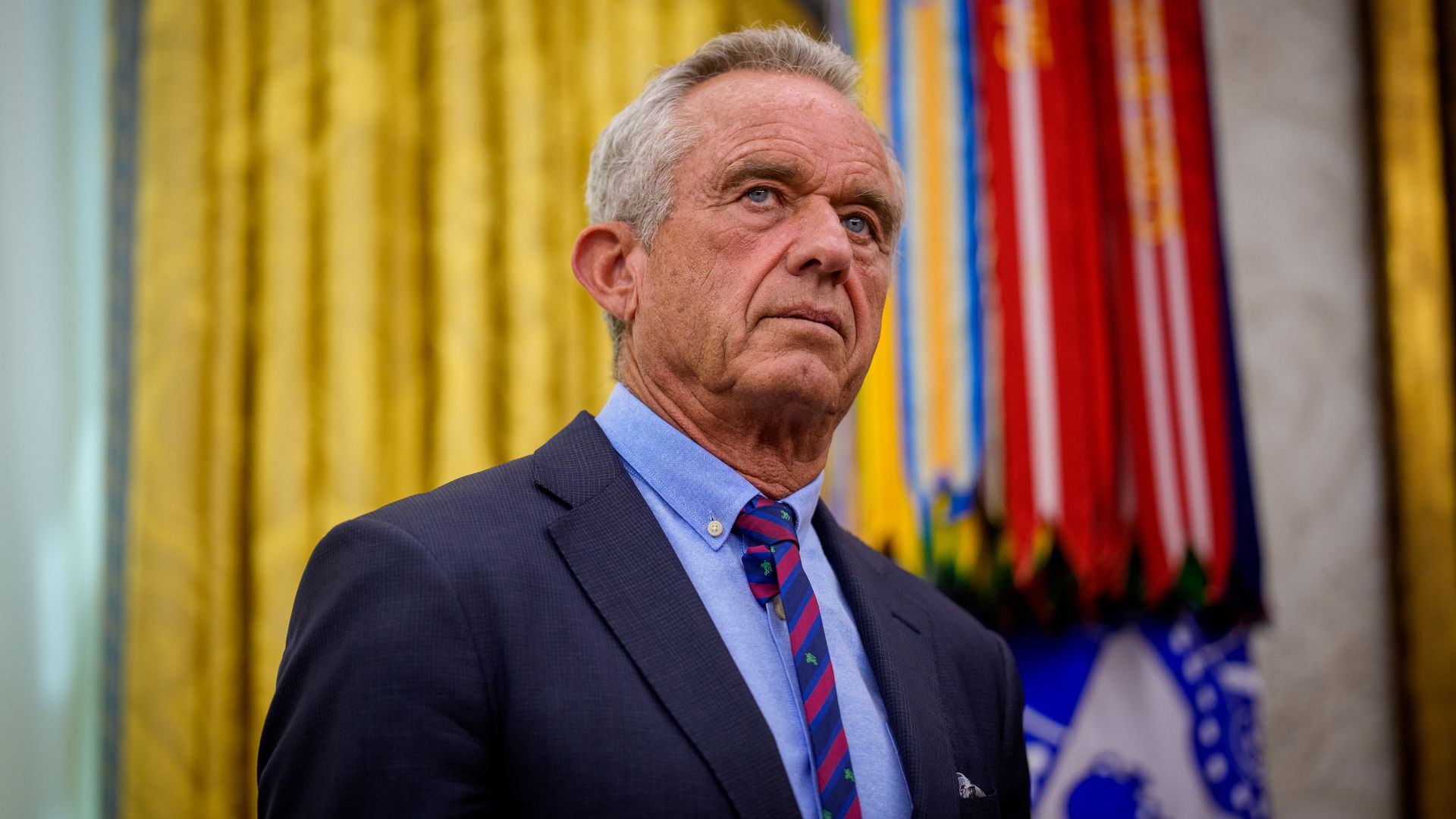 Robert F. Kennedy Jr. looks on during a swearing-in ceremony in the Oval Office.